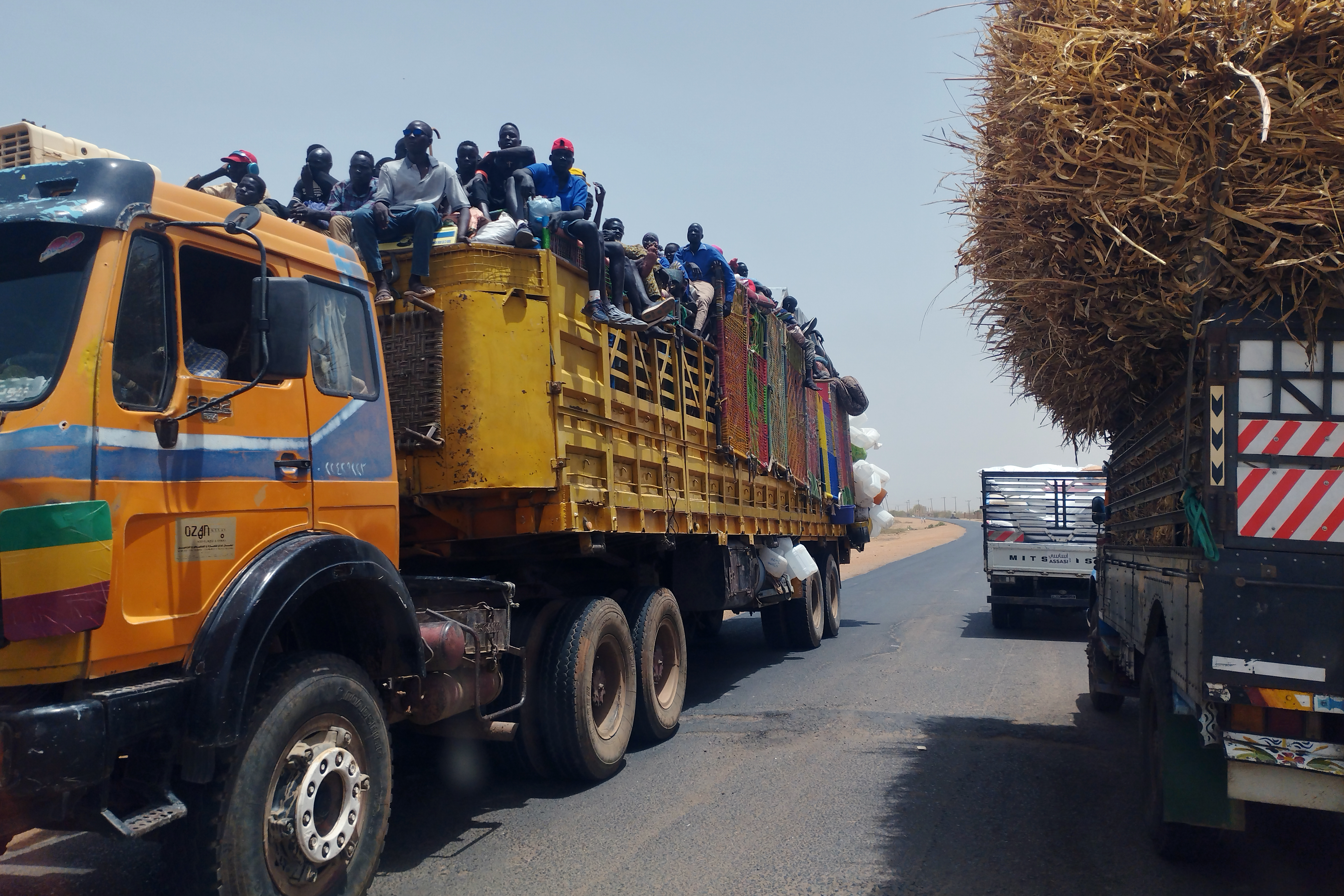 Families sharing a truck to move to Wad Madani from Khartoum, in this image taken in June 2023
