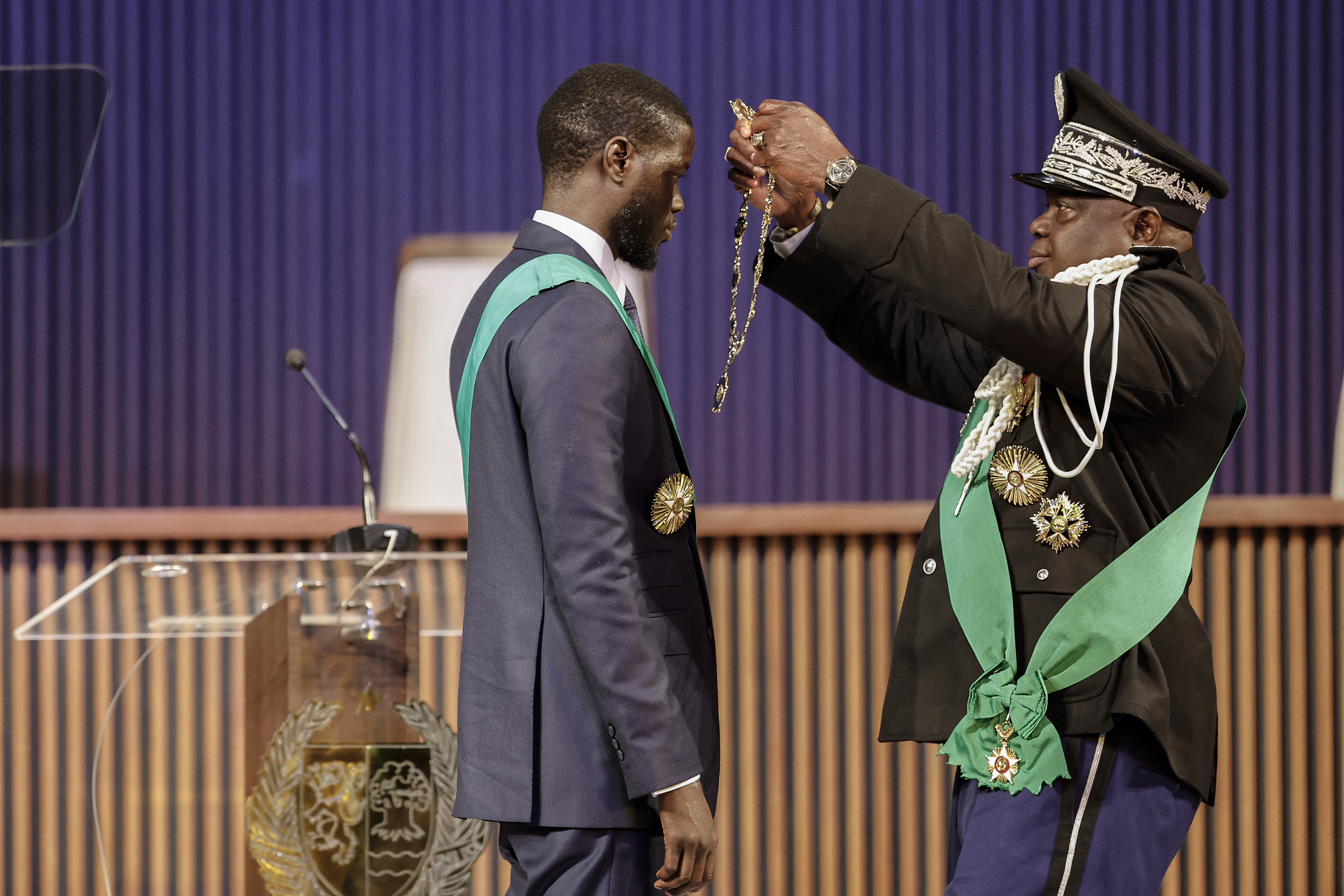 Bassirou Diomaye Faye (L) is sworn in as Senegal's President at an exhibition centre in the new town of Diamniadio near the capital Dakar