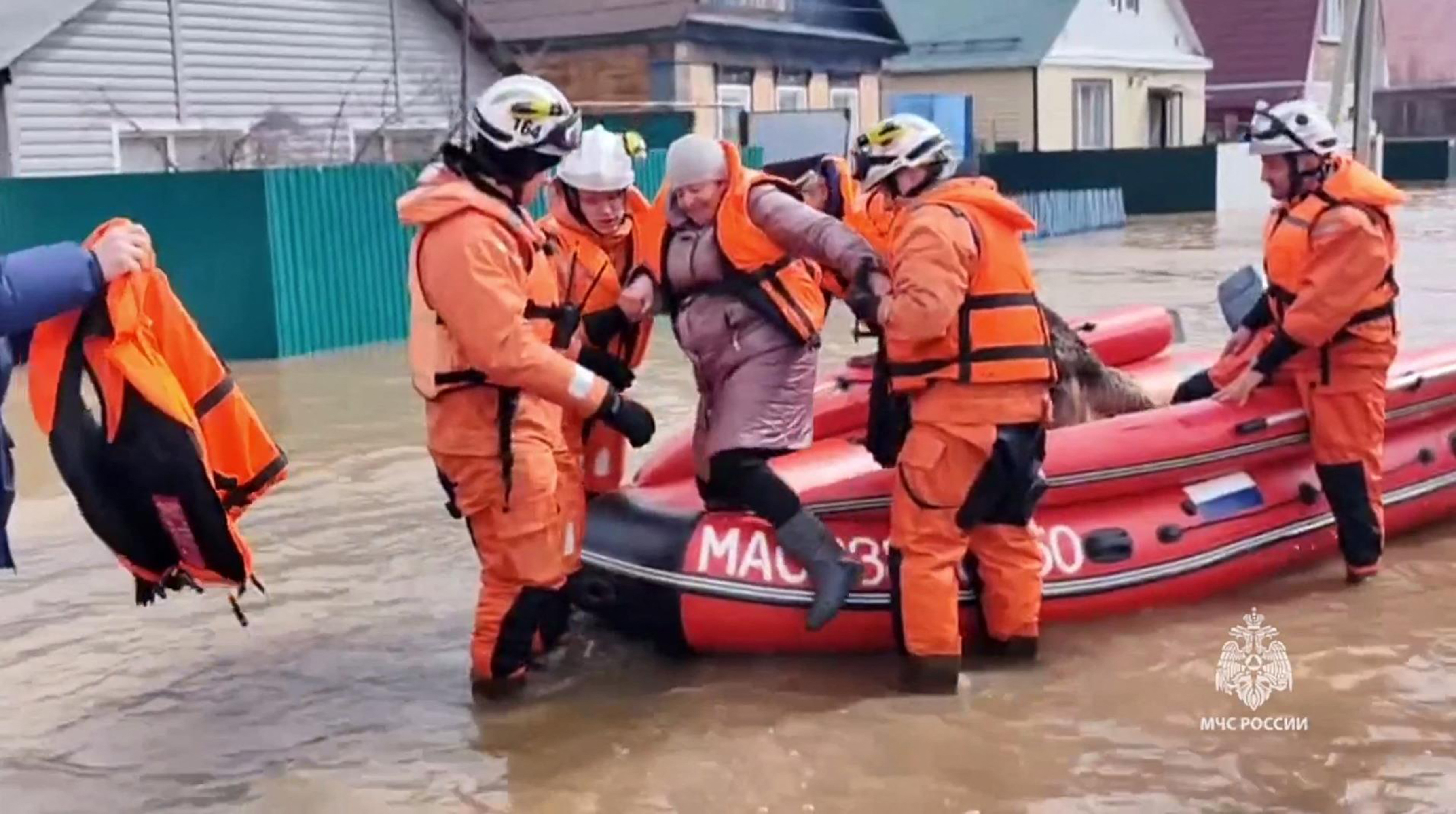 This photo taken from a video released by the Russian Emergency Situations Ministry on April 6, 2024 shows rescuers evacuate a resident