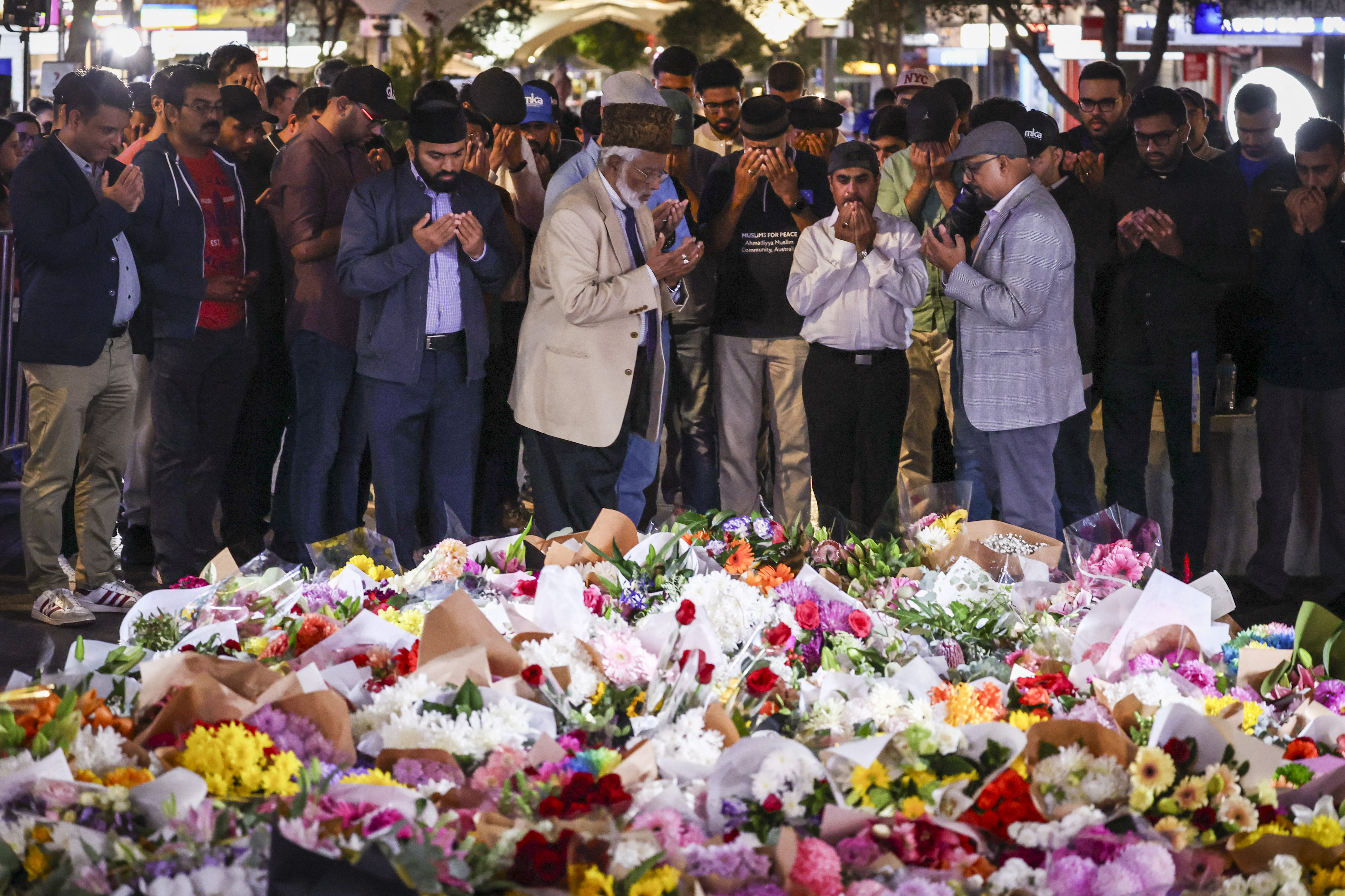 Members of the Ahmadiyya Muslim Community of Australia offer prayers for security guard Faraz Tahir, who was killed 'defending others.