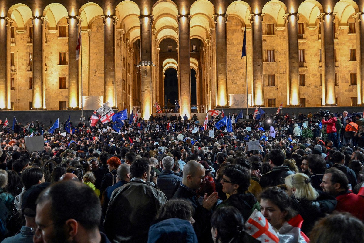 Georgian pro-democracy groups activists protest against a repressive "foreign influence" bill outside the parliament