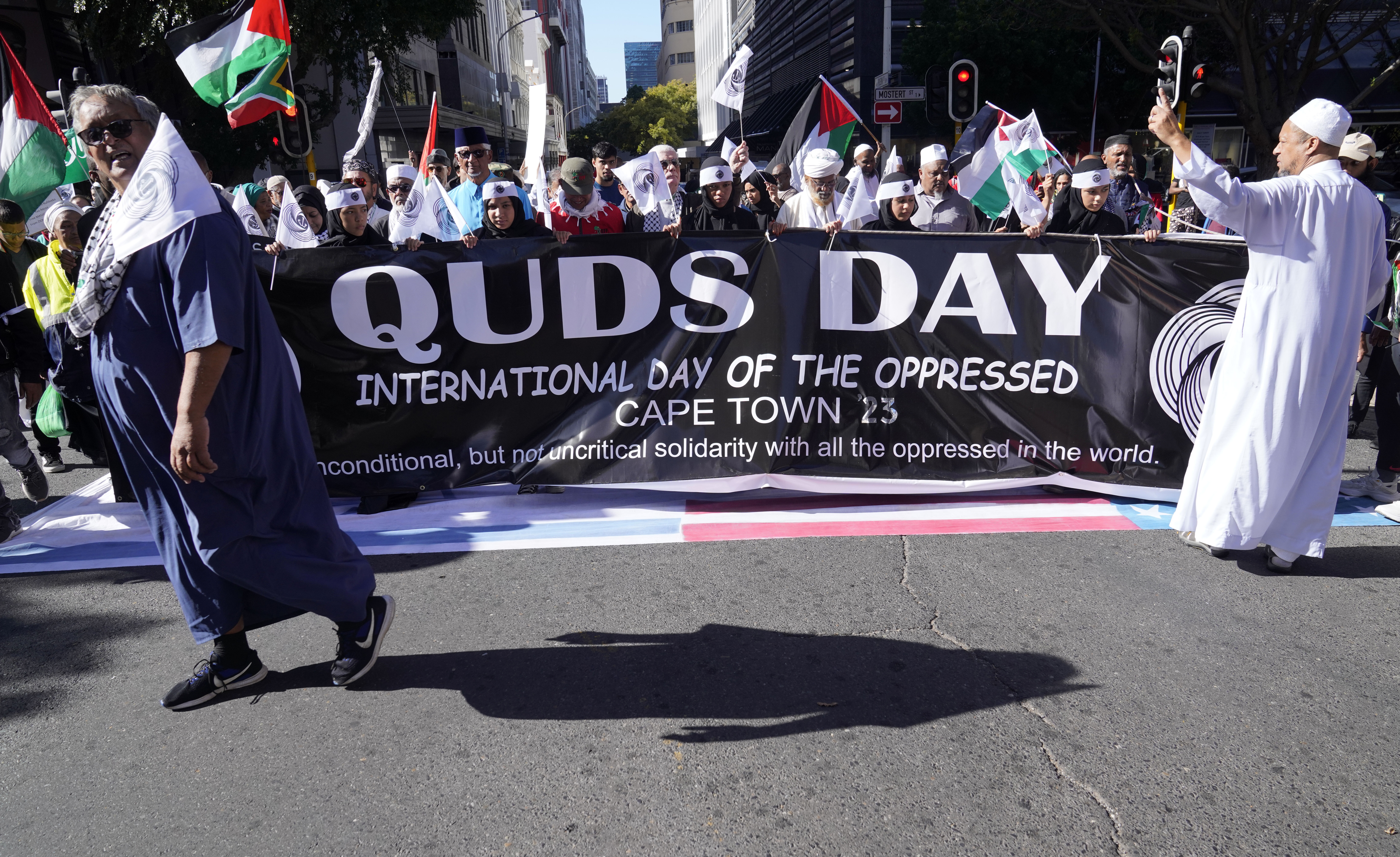 Quds Day banner held by demonstrators