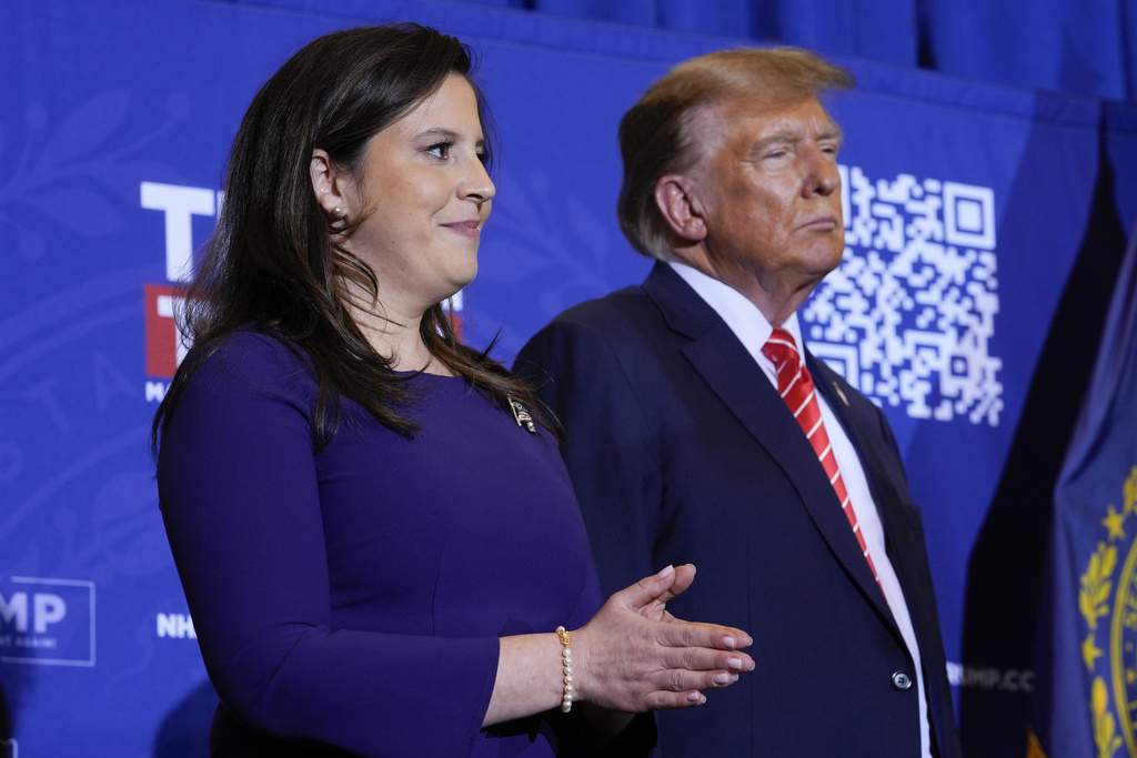 Rep. Elise Stefanik, R-N.Y., and Republican presidential candidate former President Donald Trump listen as former Rep. Lee Zeldin, R-N.Y., speaks at a campaign event in Concord, N.H
