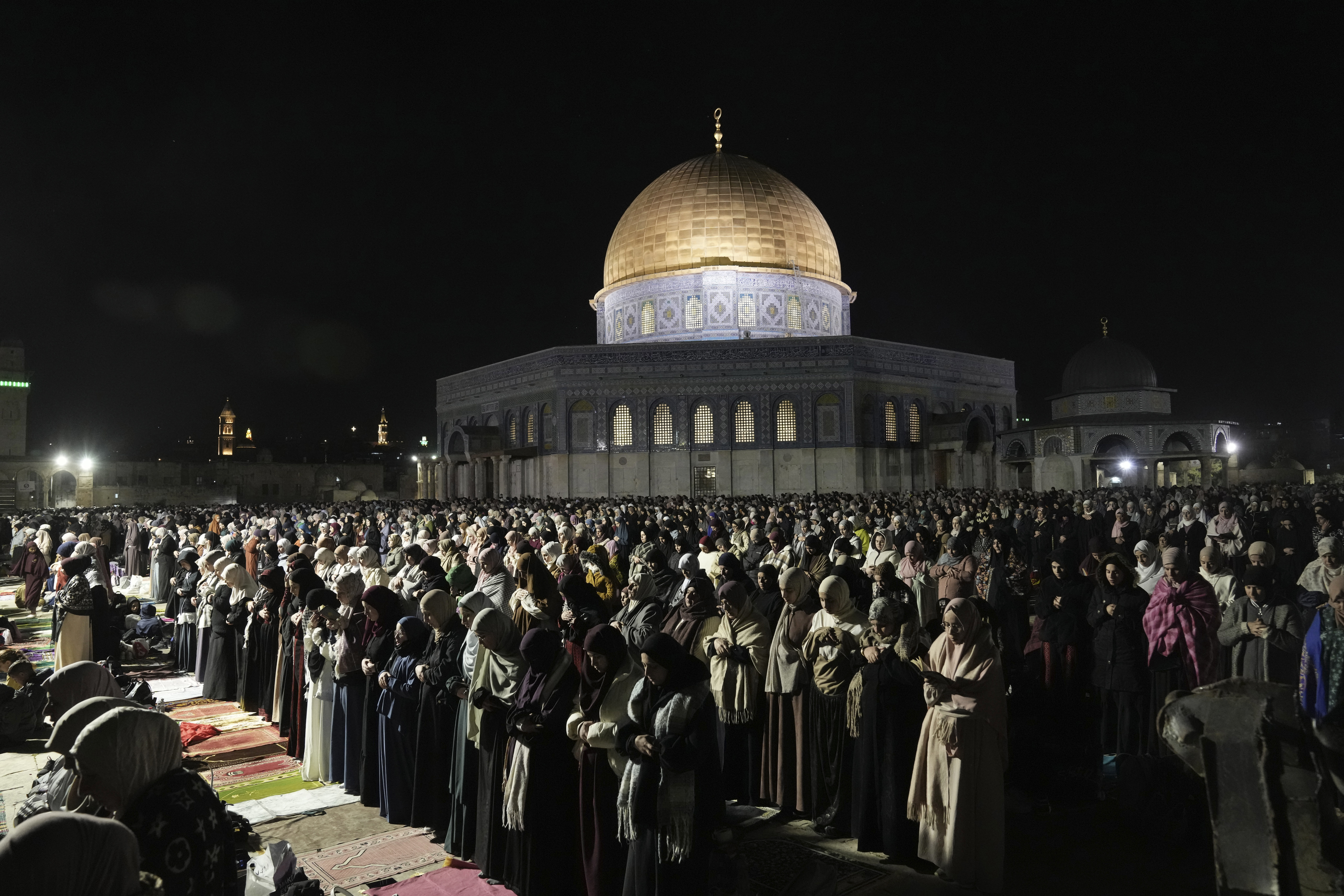 Muslims pray on Lailat al-Qadr, or night of power, that marks the last 10 days of the holy month of Ramadan, at the Al-Aqsa Mosque compound in Jerusalem's Old City, Friday, April 5