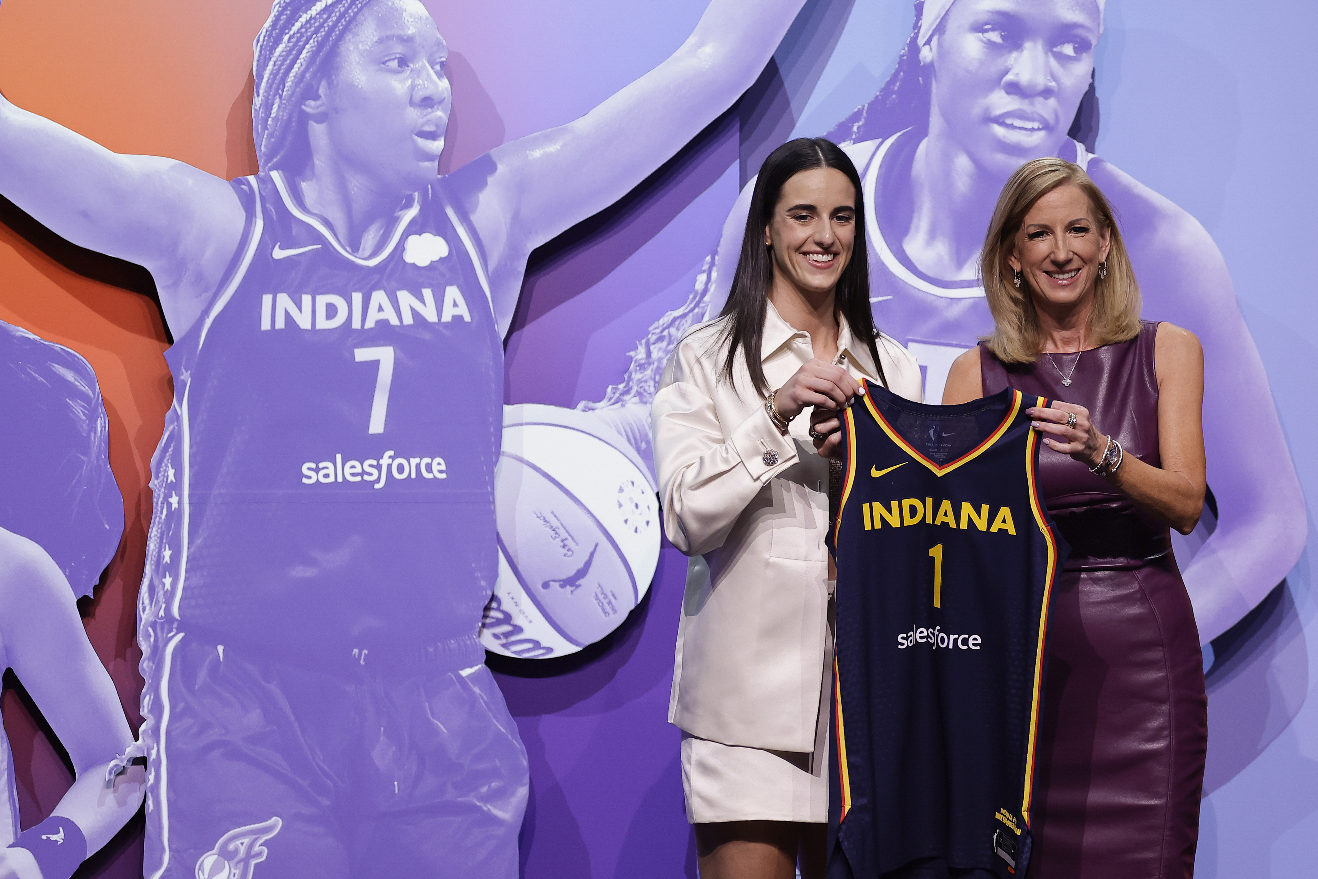Caitlin Clark receives her Indiana Fever jersey.