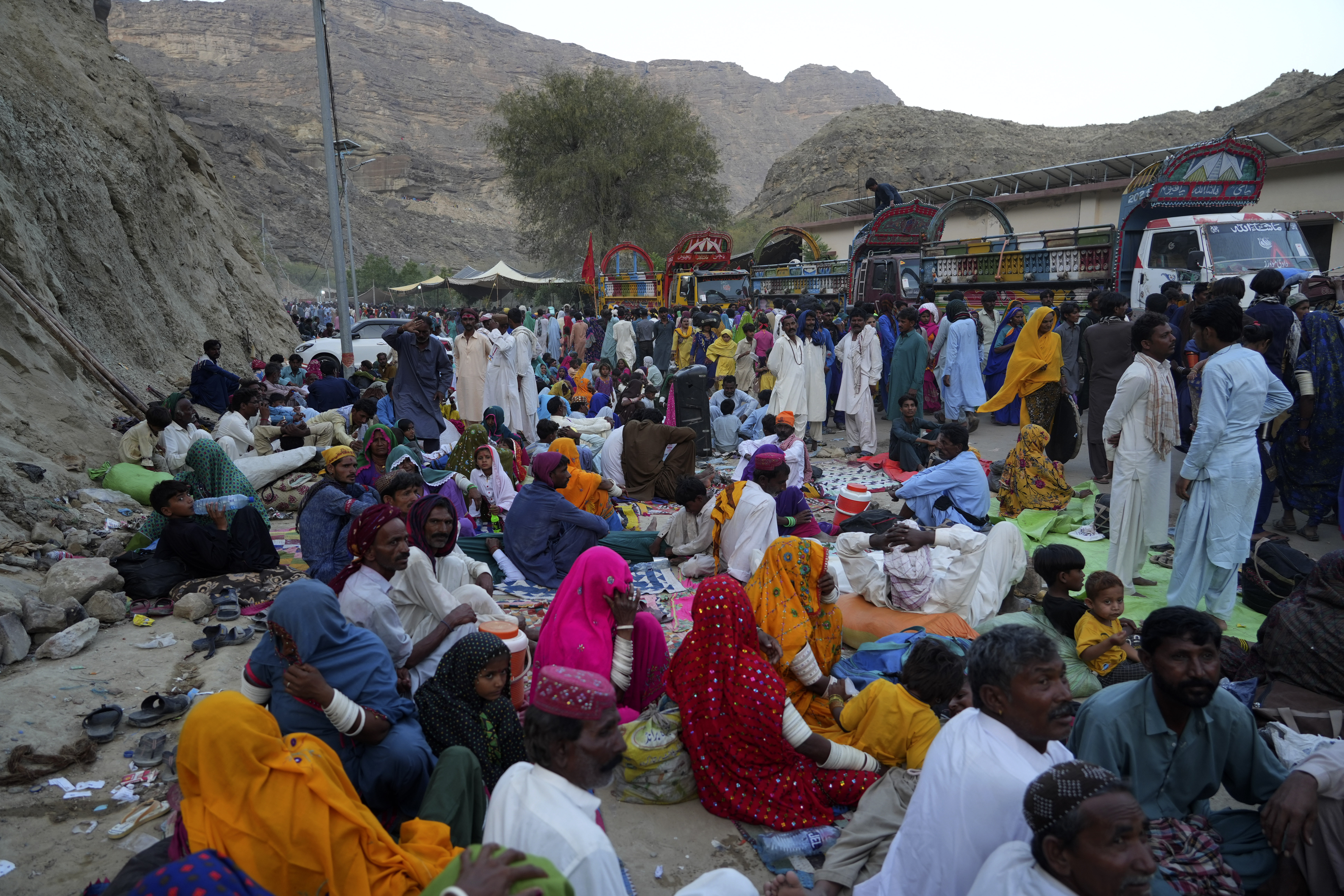 Hindu devotees take rest upon arrival at an ancient cave temple of Hinglaj Mata to attend an annual festival in Hinglaj in Lasbela district in the Pakistan's southwestern Baluchistan province, Friday, April 26