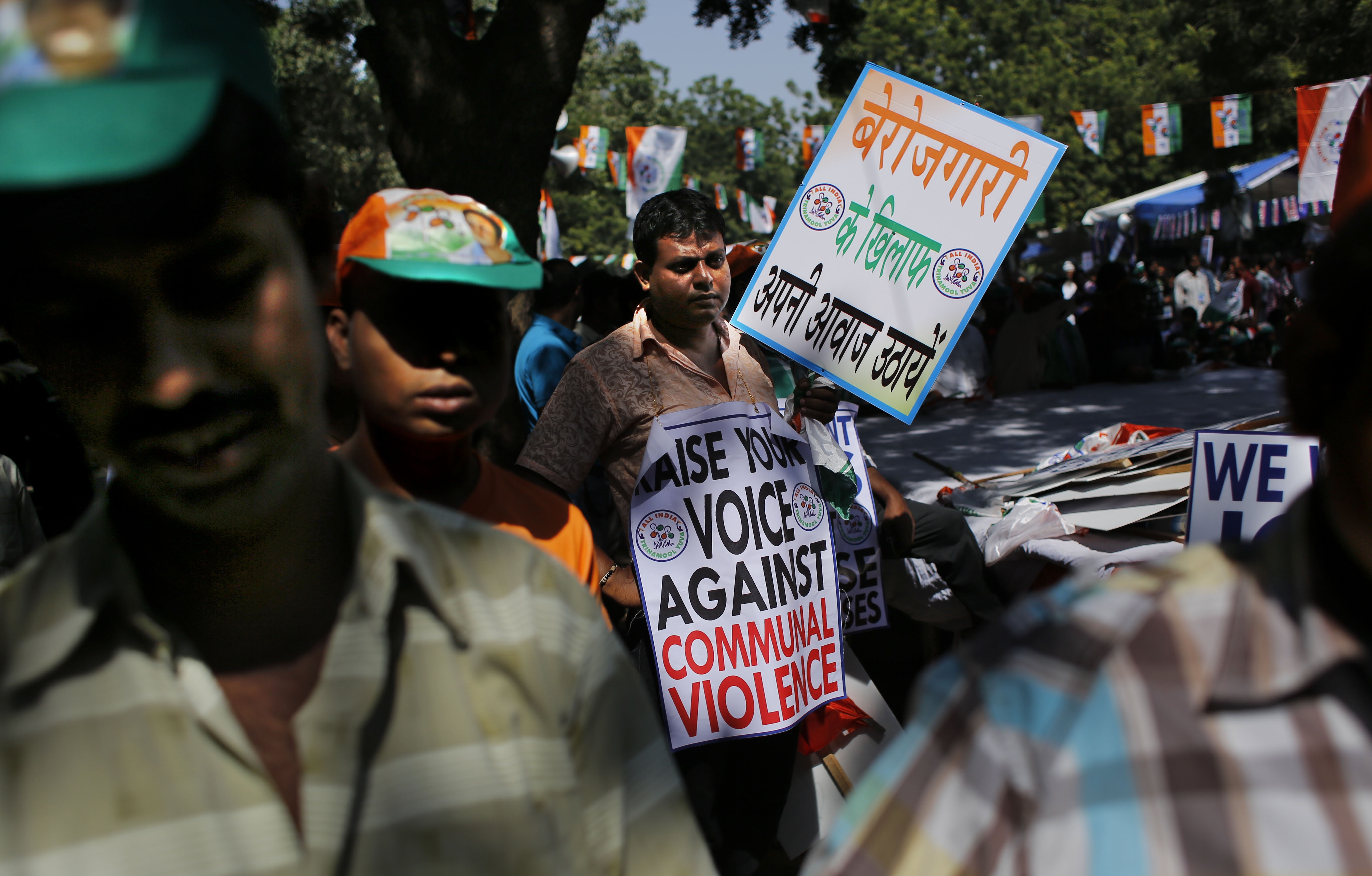 A supporter of All India Trinamool Congress (Youth) participates in an anti-government rally in New Delhi, India, Thursday, Oct. 16, 2014. Hundreds of supporters of All India Trinamool Congress (Youth) participated in a protest rally to highlight rise in communal violence, lack of job opportunities among other problems rampant throughout the country, according to the party press release. Placard reads, "Raise your voice against unemployment". (AP Photo/Altaf Qadri)