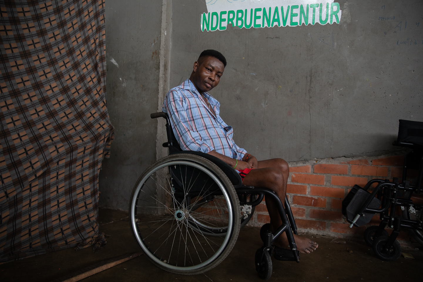 Marcial Moreno, a wheelchair user, poses for a photo in the Crystal Coliseum.