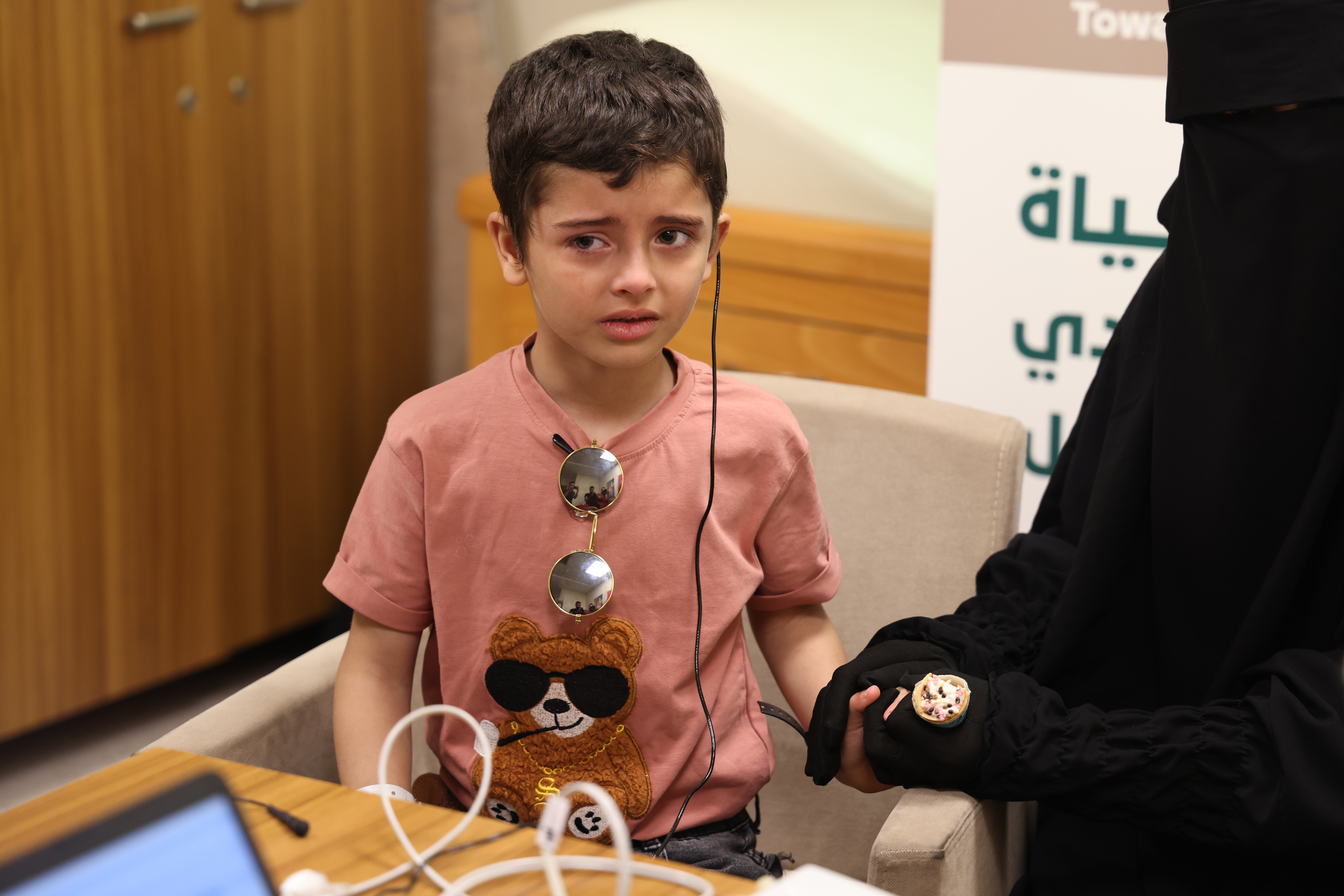 Aslan cries after hearing the first voice in his life in Reyhanli, Turkey