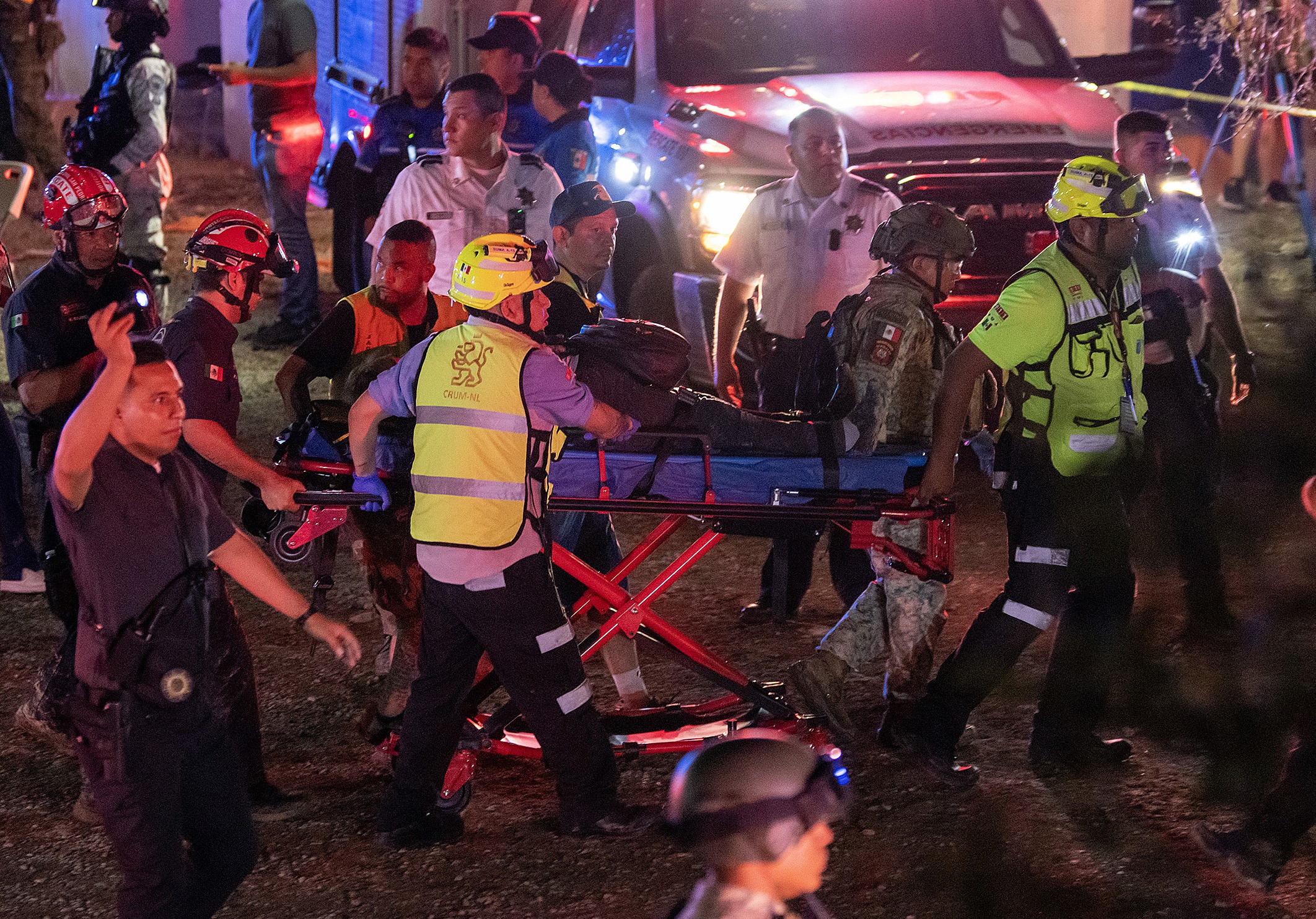 Paramedics evacuate one of the injured people after a stage collapsed at an election campaign rally in a suburb of Monterrey, capital of the northern Nuevo Leon state, Mexico