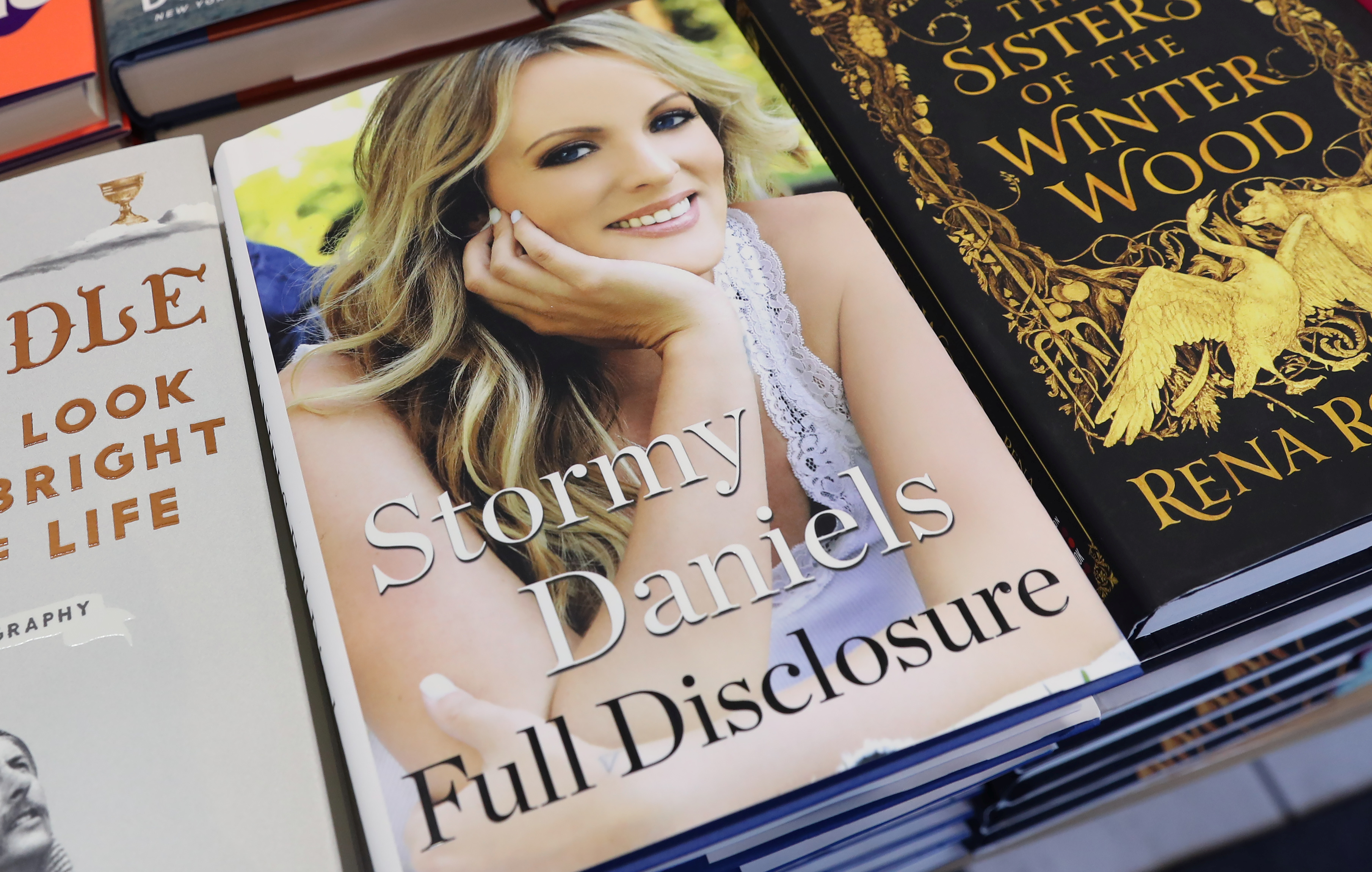 A copy of the book Full Disclosure, with author Stormy Daniels on the cover.