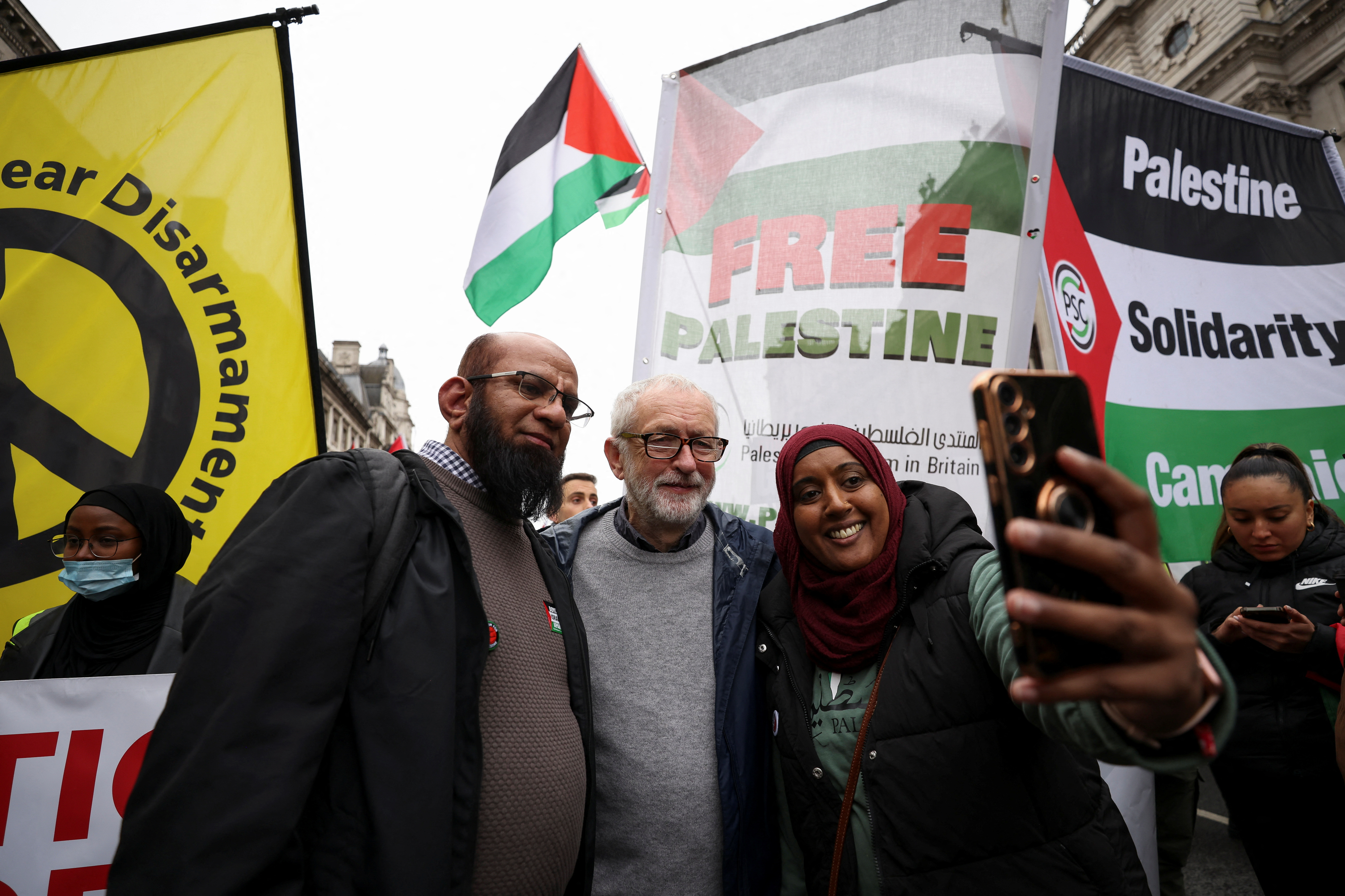 Former leader of the Labour Party Jeremy Corbyn poses as people protest during a march in solidarity with Palestinians in Gaza, amid the ongoing conflict between Israel and the Palestinian Islamist group Hamas, in London, Britain, April 27, 2024. REUTERS/Hollie Adams