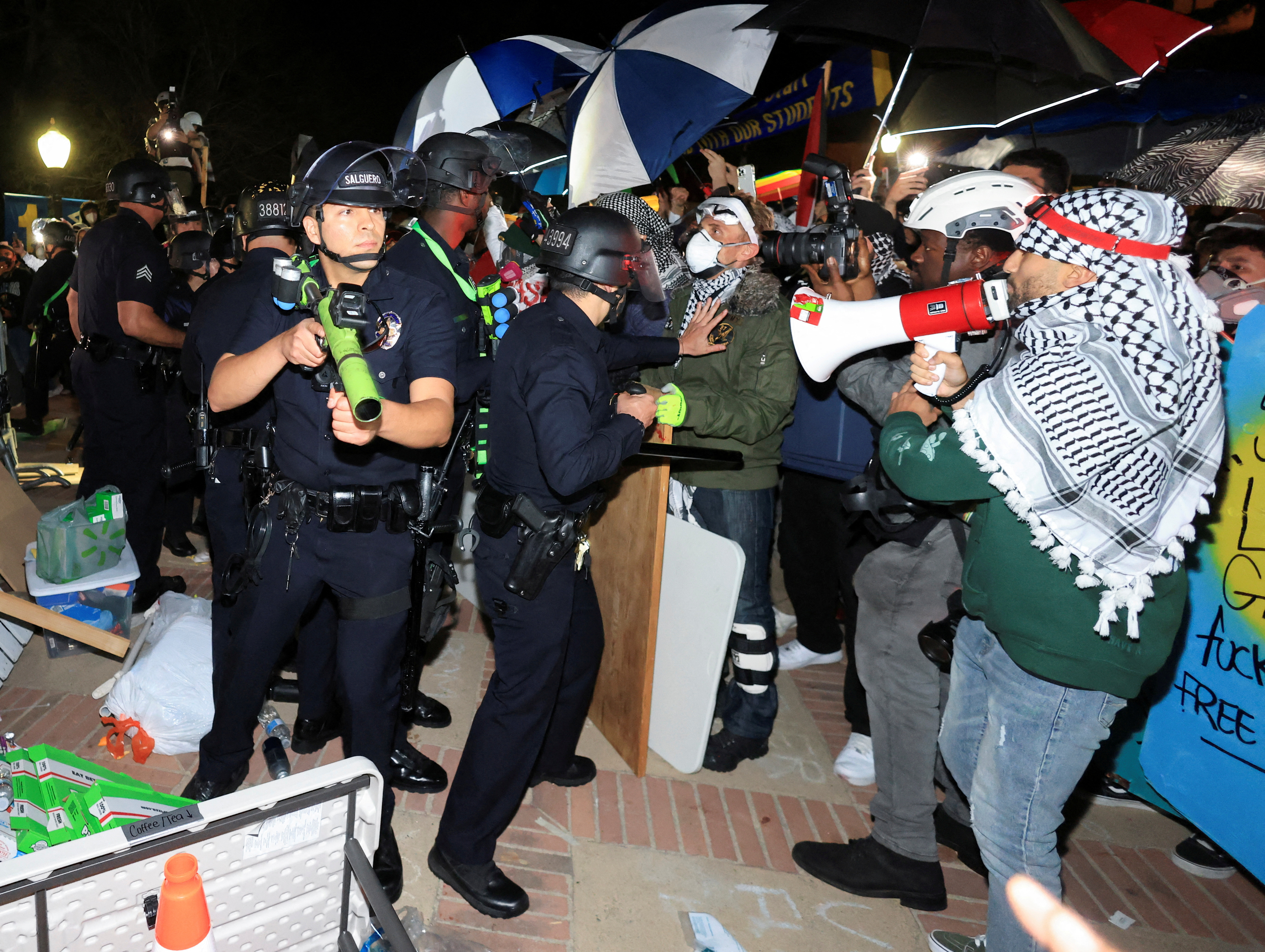 Law enforcement officers enter a pro-Palestinian protest encampment at the University of California Los Angeles (UCLA), as the conflict between Israel and the Palestinian Islamist group Hamas continues, in Los Angeles, California, U.S