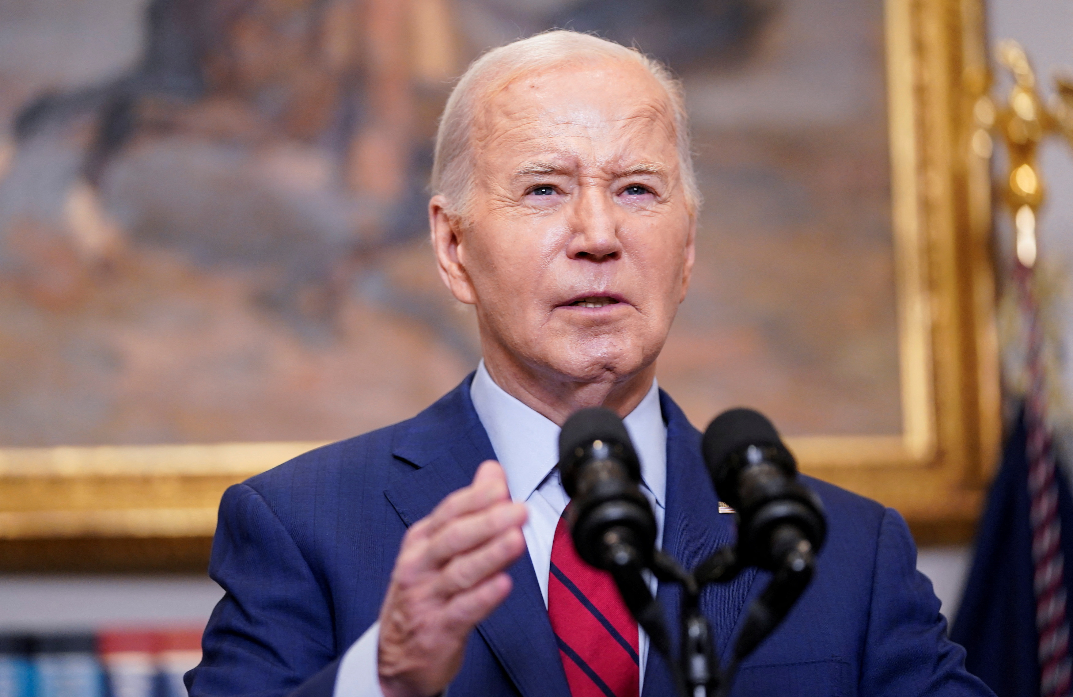 Joe Biden speaks at a podium at the White House