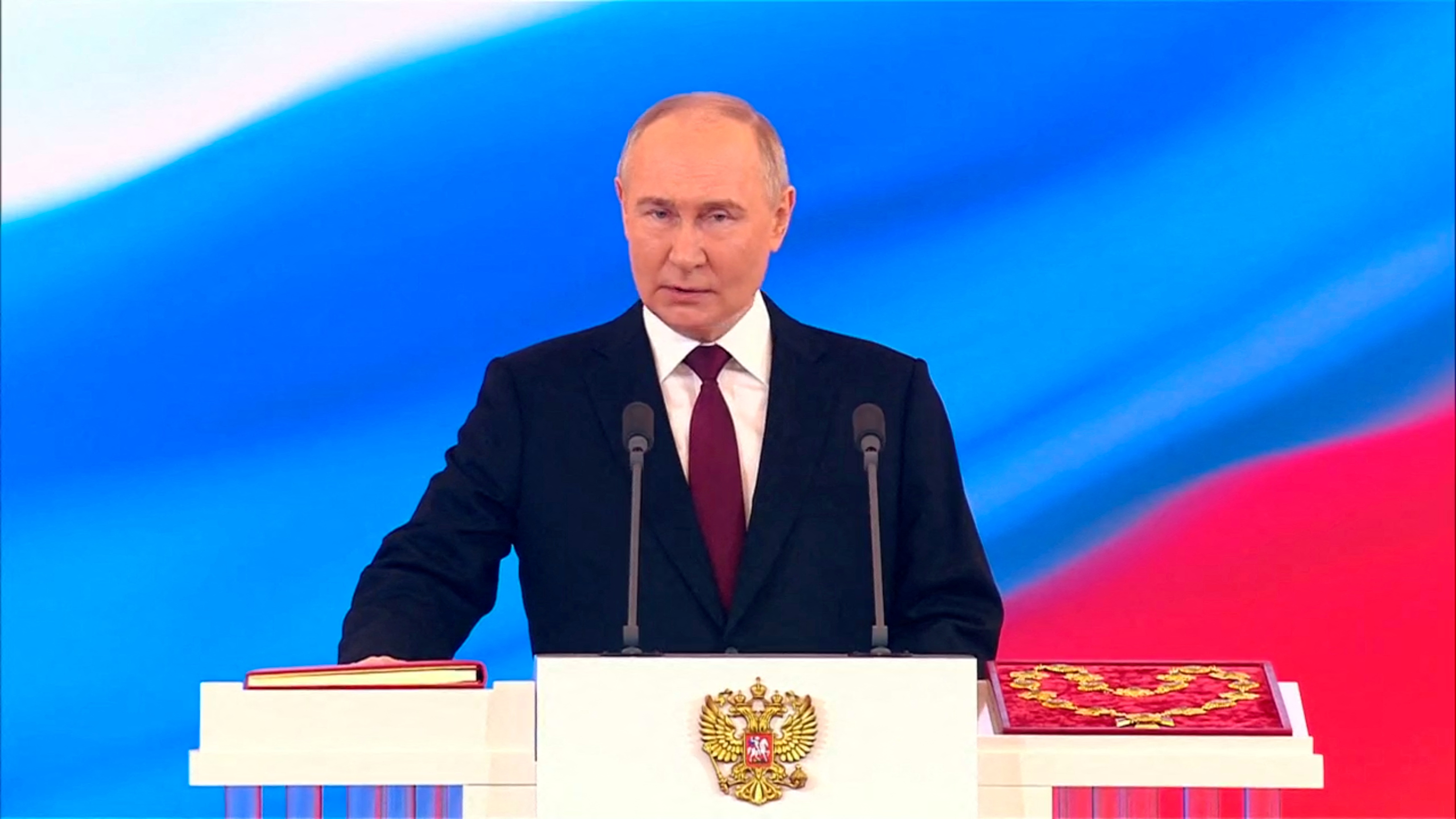 Russian President Vladimir Putin takes the oath during an inauguration ceremony at the Kremlin