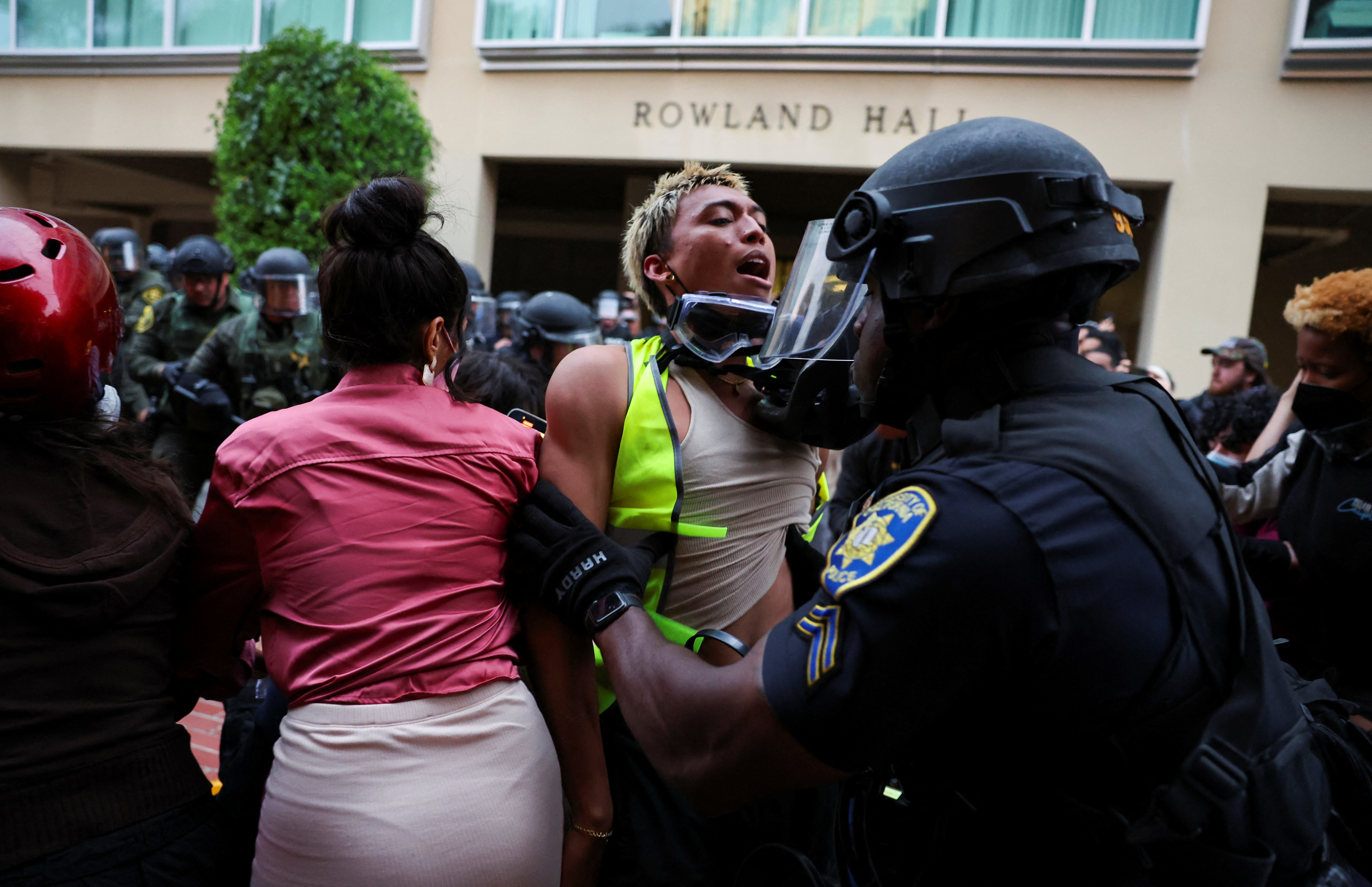 Law enforcement officers deployed to the University of California, Irvine (UC Irvine) detain demonstrators, after protesters against the war in Gaza surrounded the physical sciences lecture hall, as the conflict between Israel and the Palestinian Islamist group Hamas continues, in Irvine, California, U.S. May 15, 2024. REUTERS/Mike Blake
