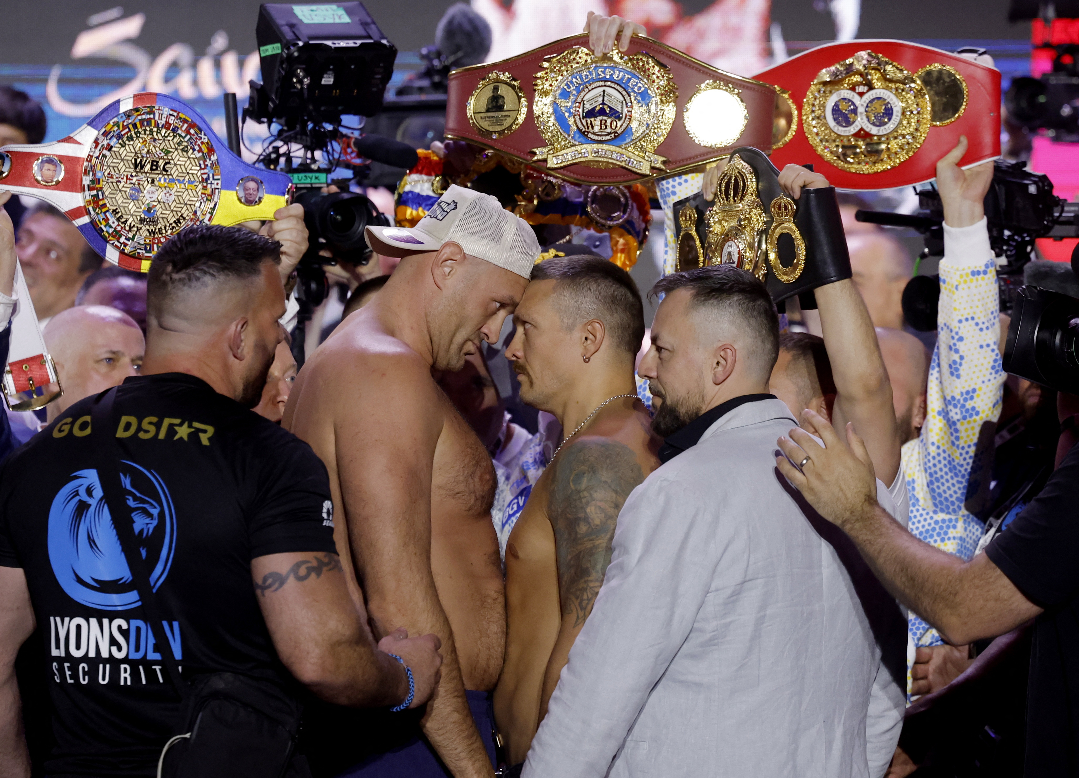 Boxing - Tyson Fury v Oleksandr Usyk - Weigh-in - BLVD City - Music World, Riyadh, Saudi Arabia - May 17, 2024 Tyson Fury and Oleksandr Usyk face off during the weigh-in Action Images via Reuters/Andrew Couldridge