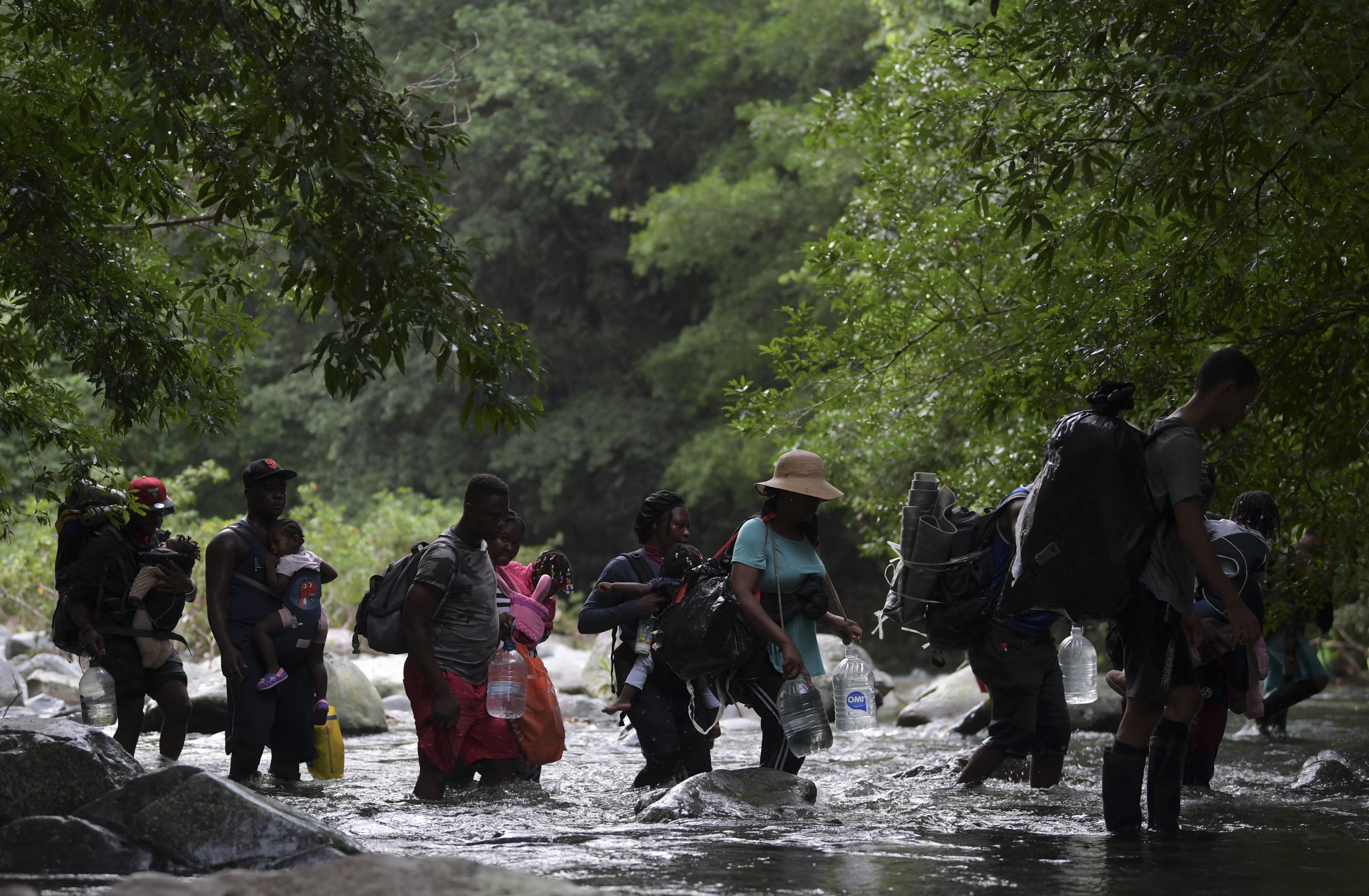 Haitian migrants cross the jungle of the Darien Gap, near Acandi, Choco department, Colombia, heading to Panama, on September 26, 2021, on their way trying to reach the US