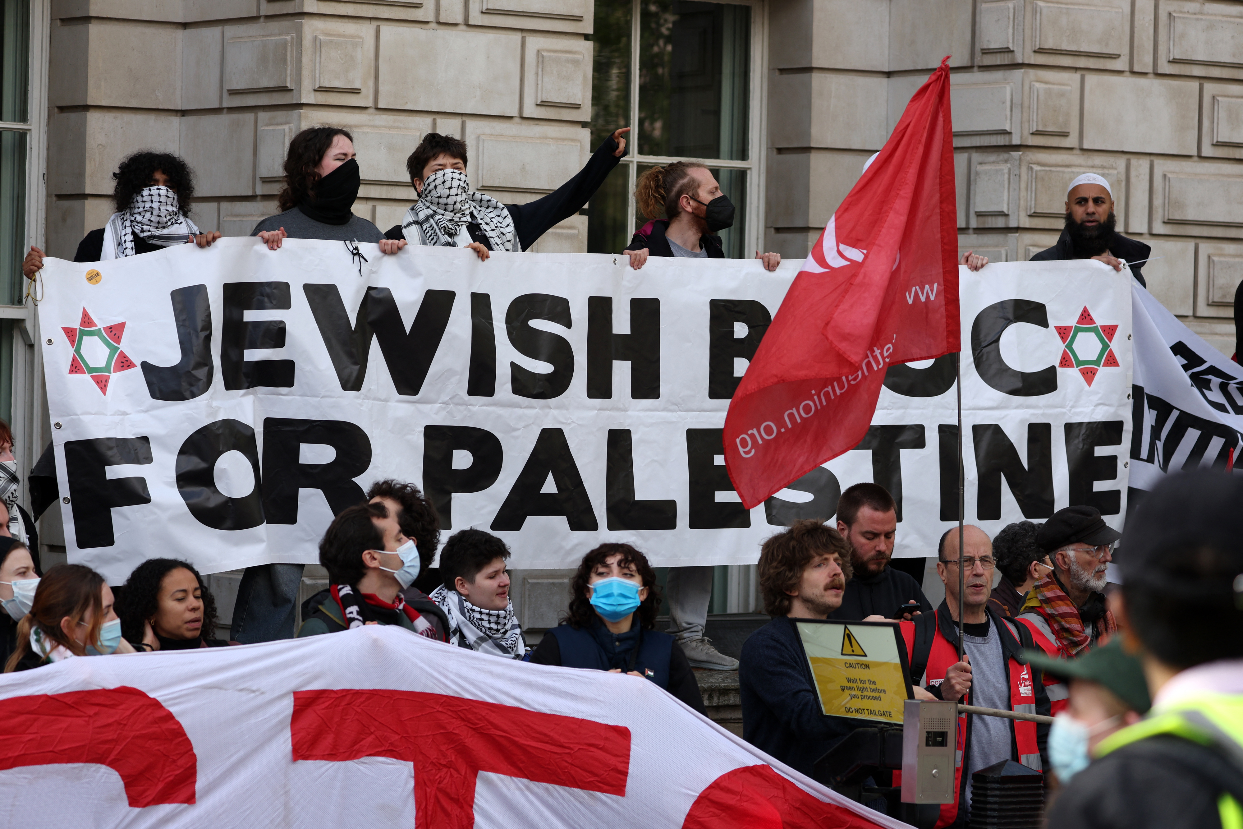 Members of the Jewish Bloc for Palestine take part in a Free Gaza protest, near Admiralty Arch in central London