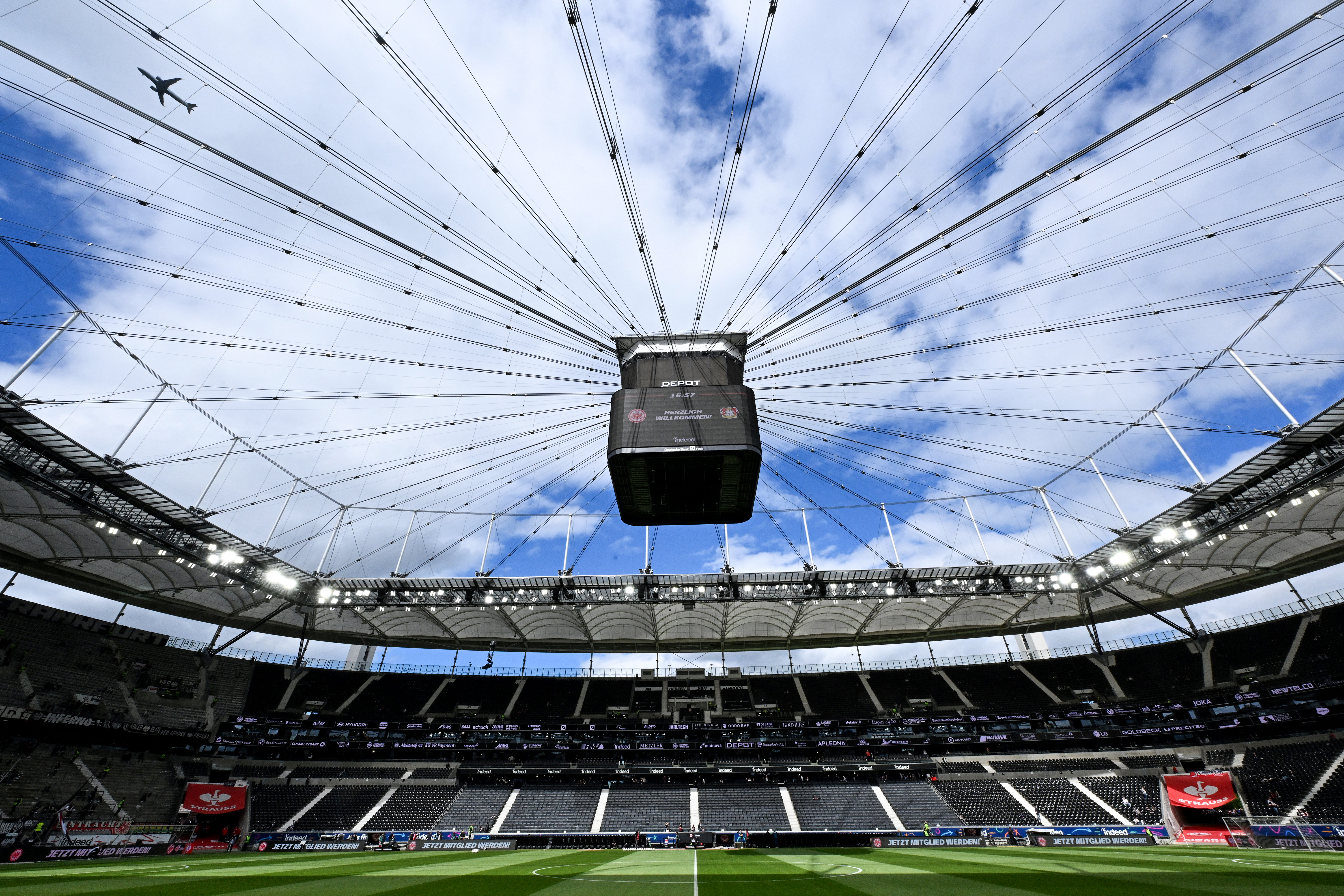 Plane flies over football stadium in Germany.