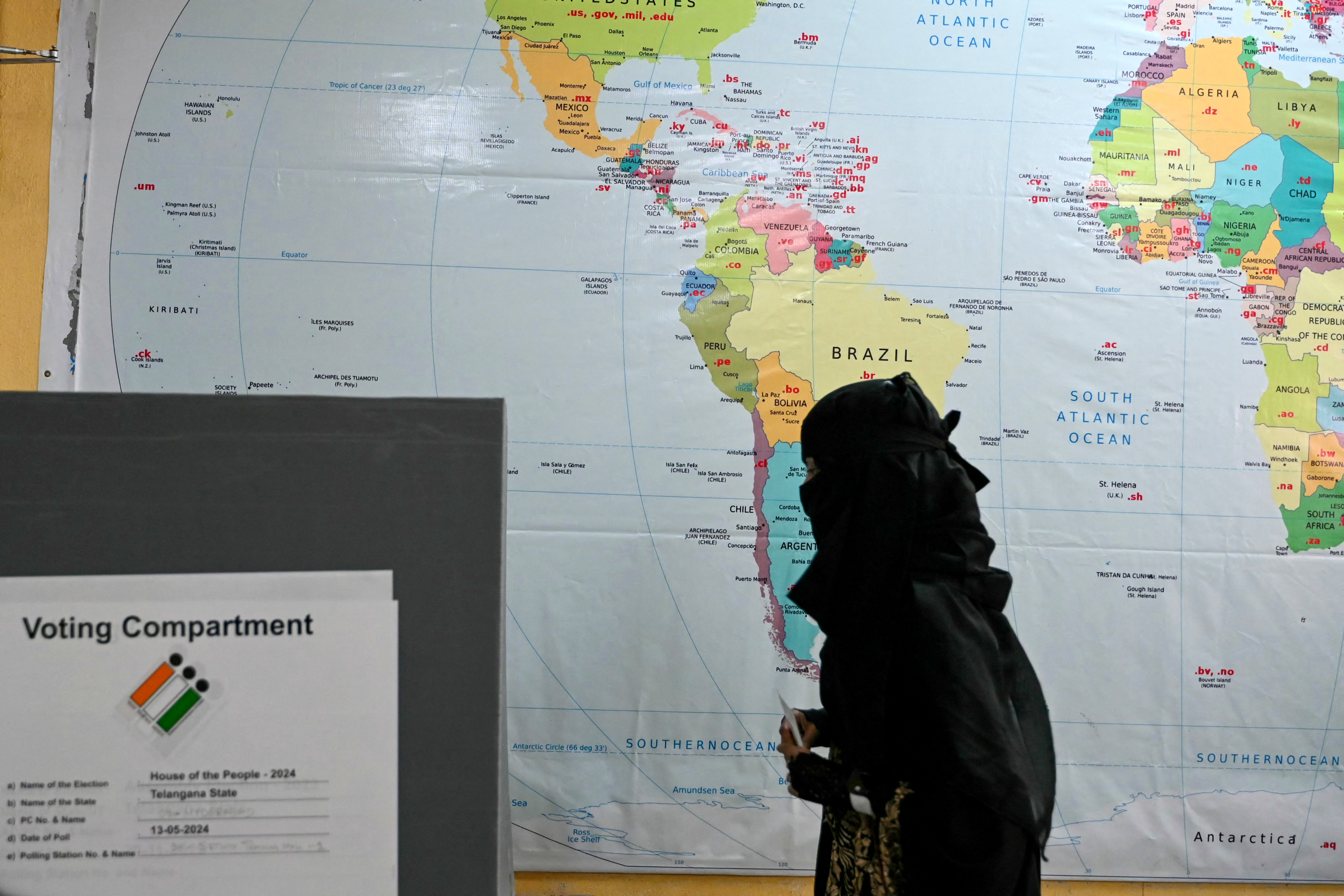 A Muslim woman arrives to cast her ballot at a polling station during the fourth phase of voting in Indias general election, in Hyderabad on May 13, 2024.