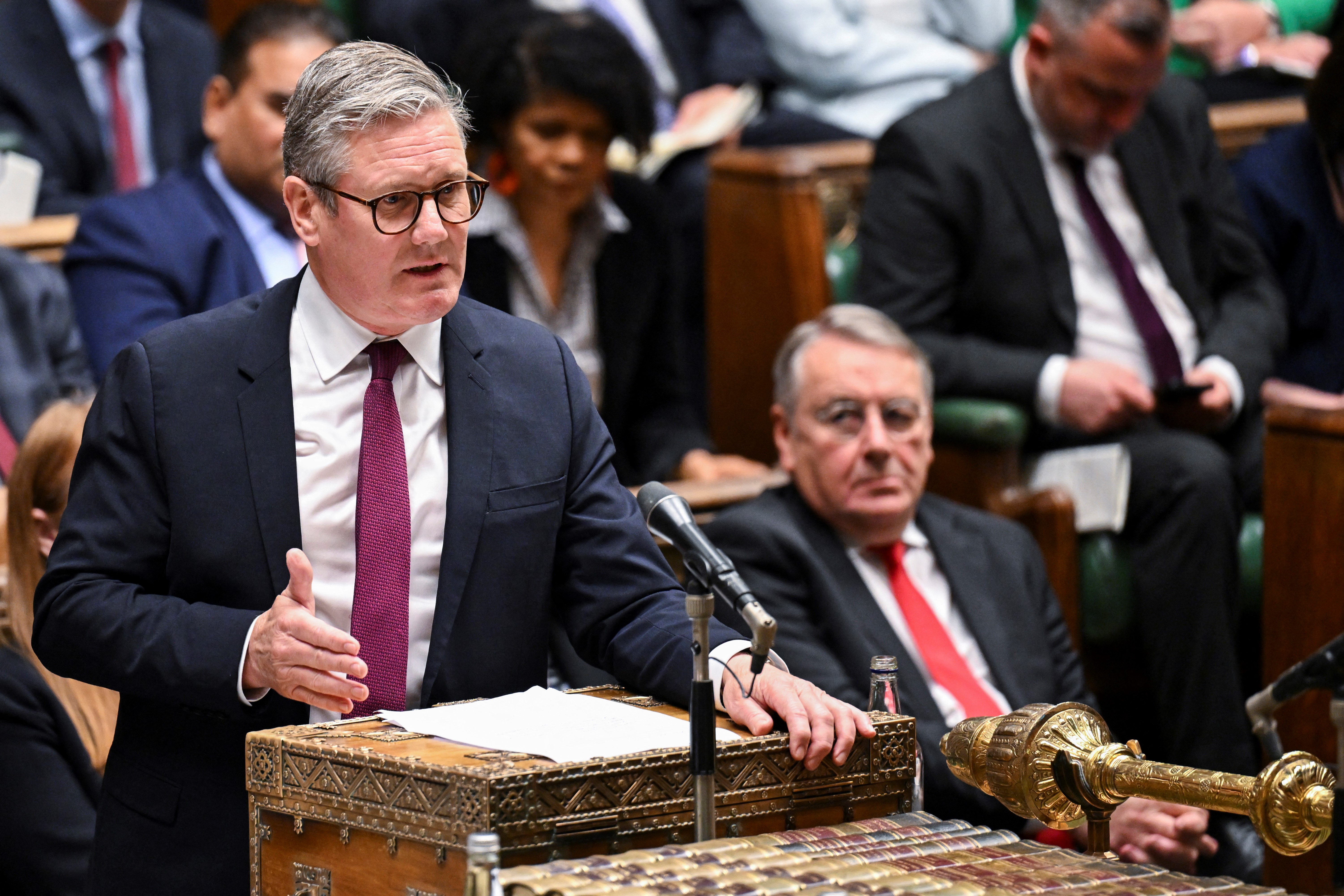 A handout photograph released by the UK Parliament shows Britain's main opposition Labour Party leader Keir Starmer speaking during the weekly session of Prime Minister's Questions