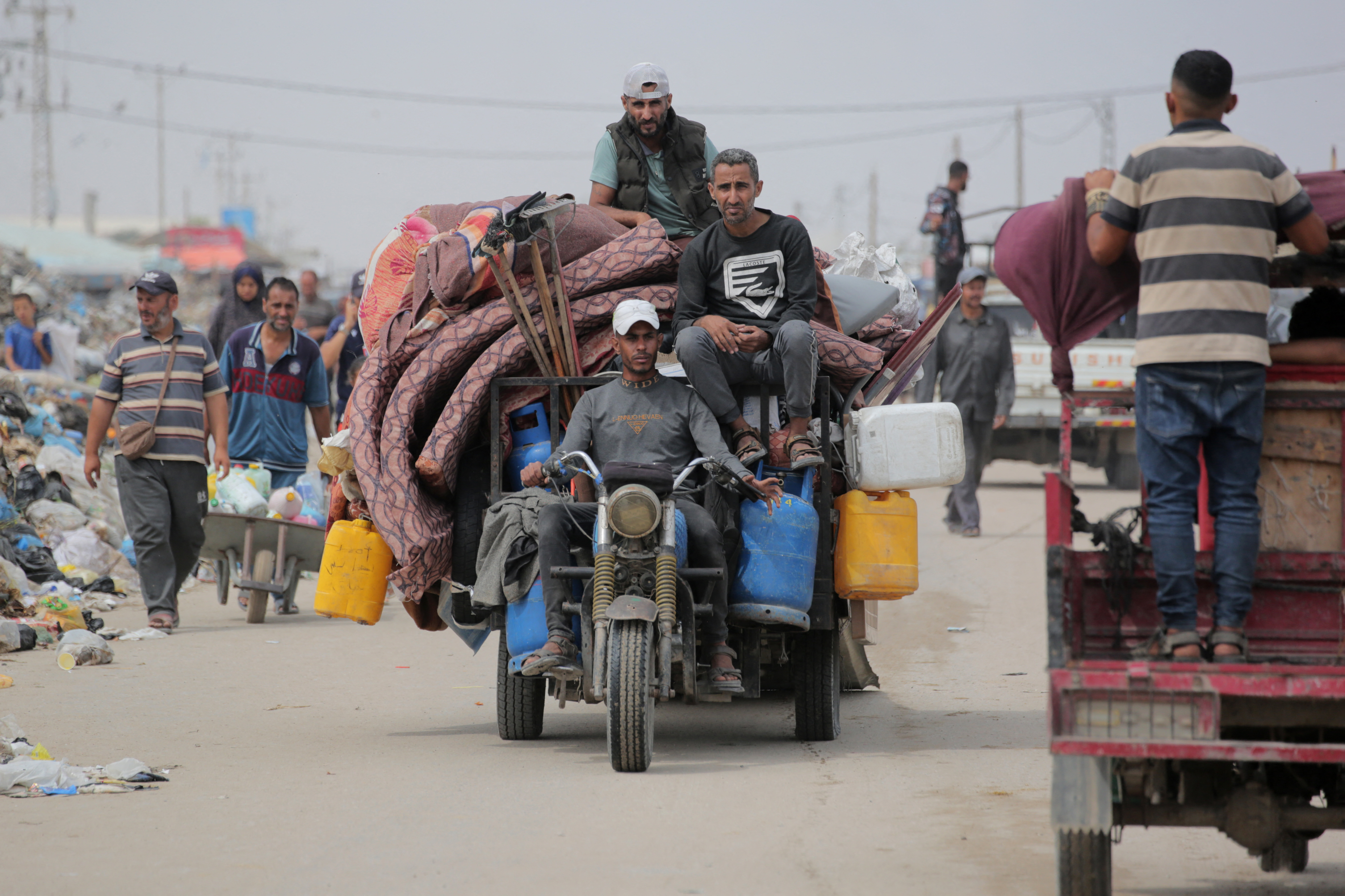 Palestinians flee the area of Tal al-Sultan in Rafah