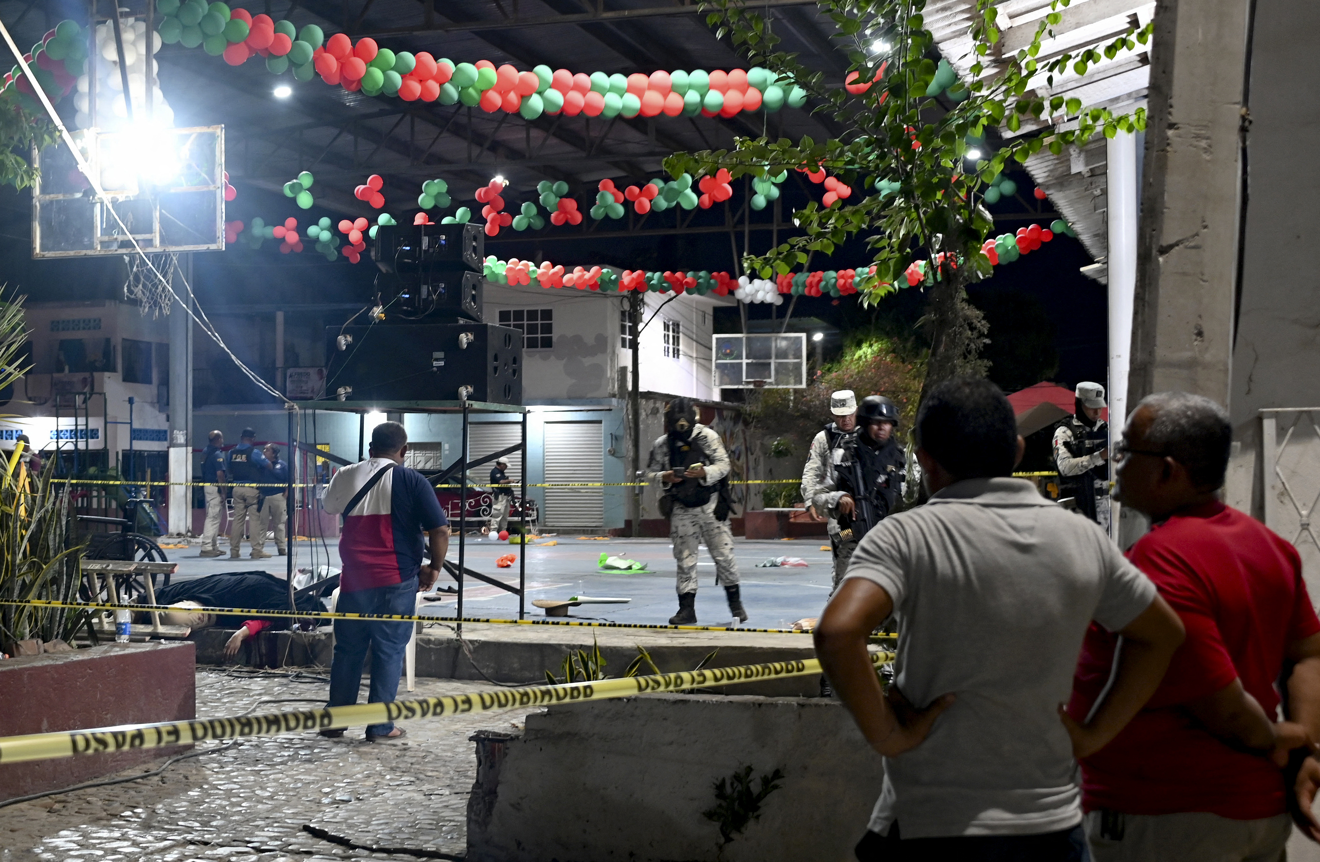 Members of the National Guard custody the crime scene of the mayoral candidate of the opposition, Alfredo Cabrera, murdered during his electoral campaign closure in Las Lomas, Guerrero, Mexico