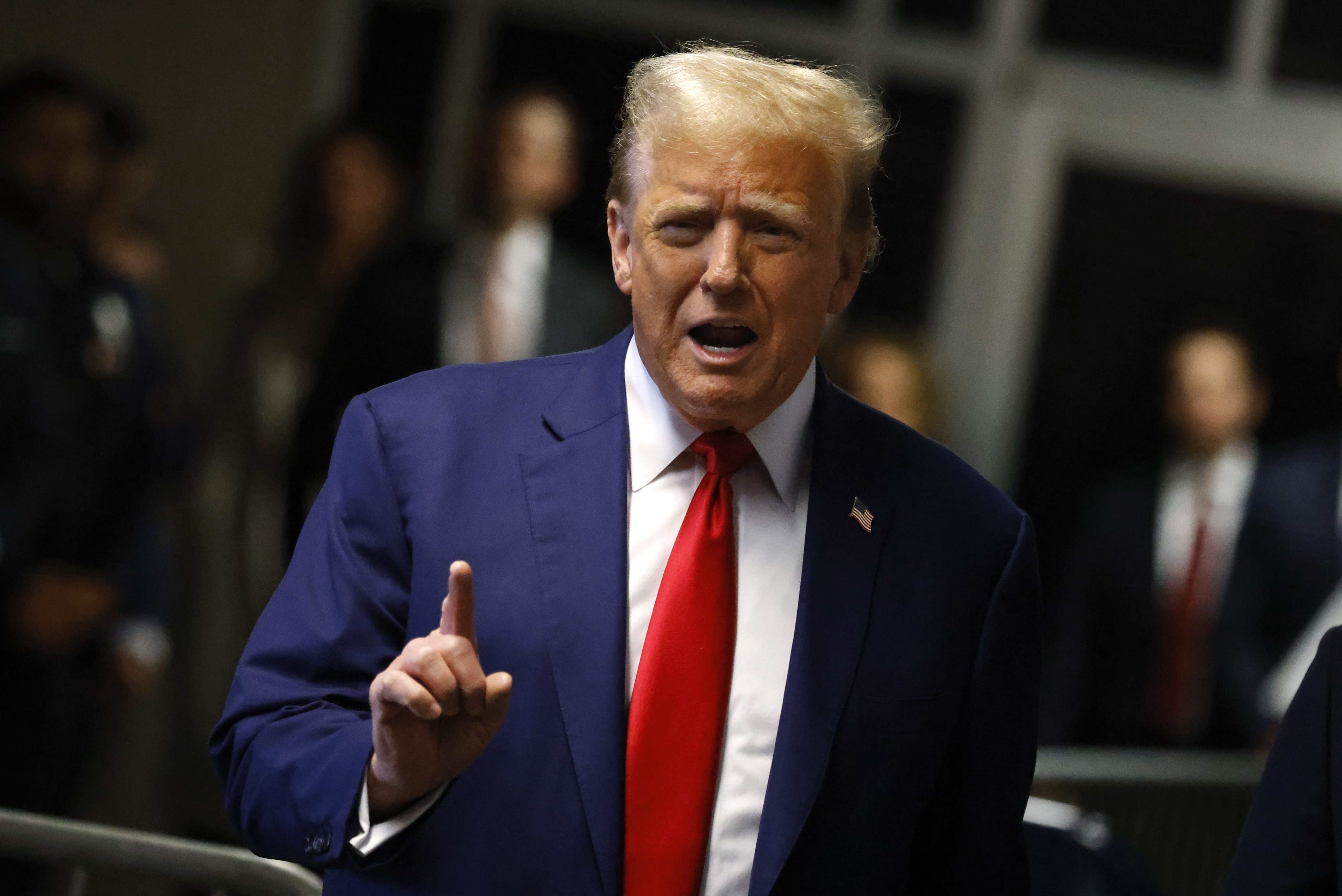 Former US President Donald Trump speaks to reporters outside his criminal trial in New York