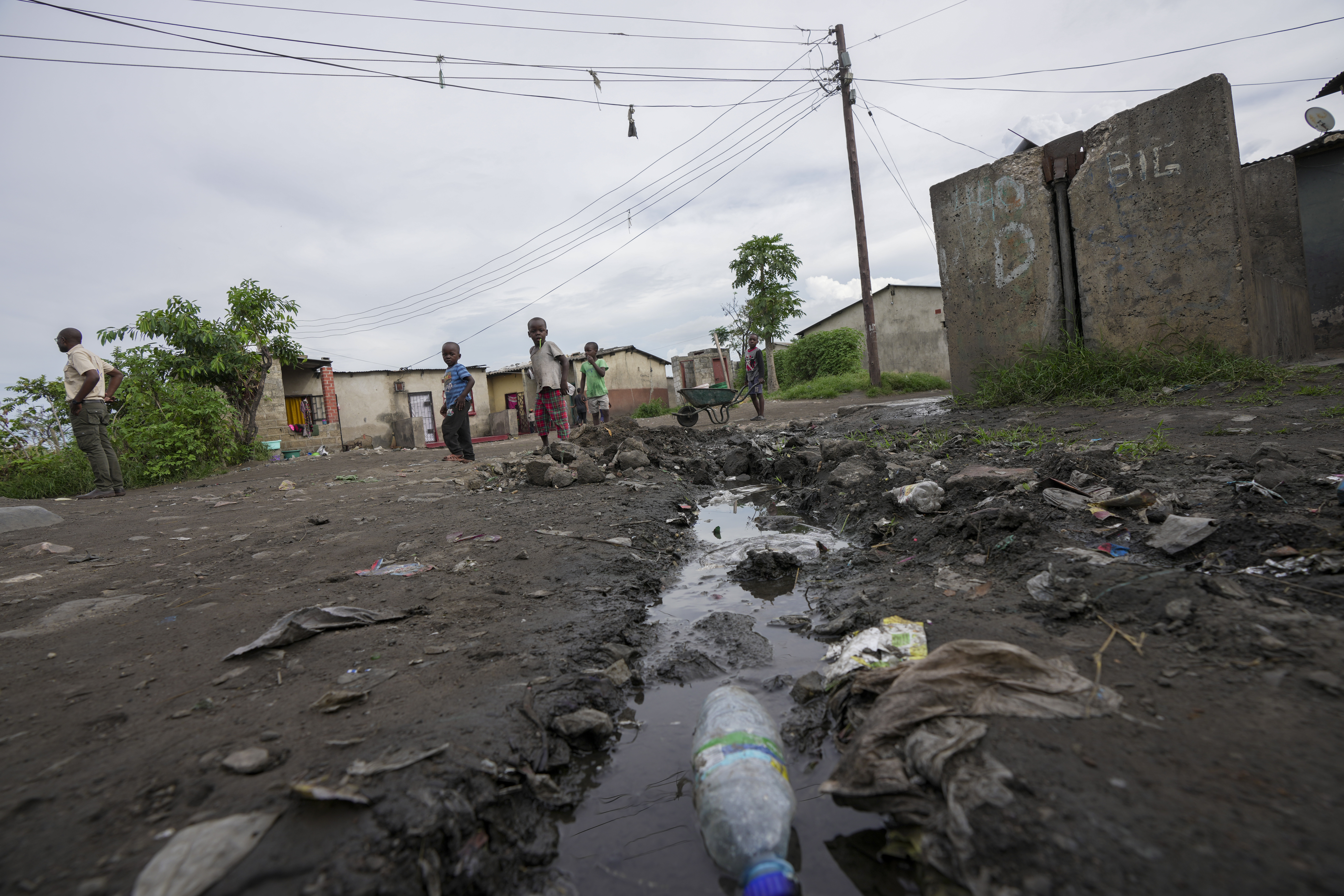 Children play near stagnant pools of water in Lilanda township in Lusaka, Zambia,