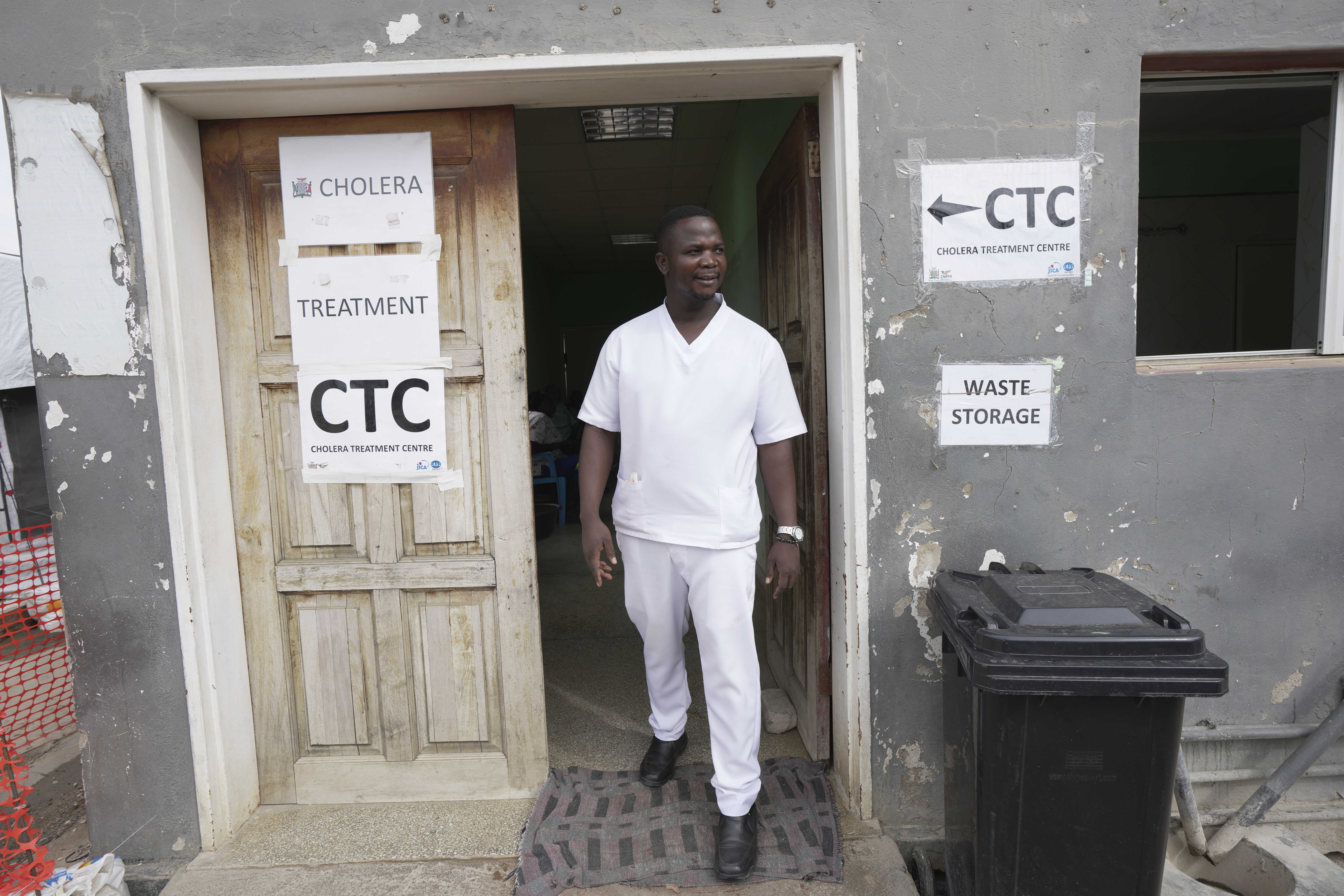 A nurse exits from a cholera treatment centre in Lusaka, Zambia,