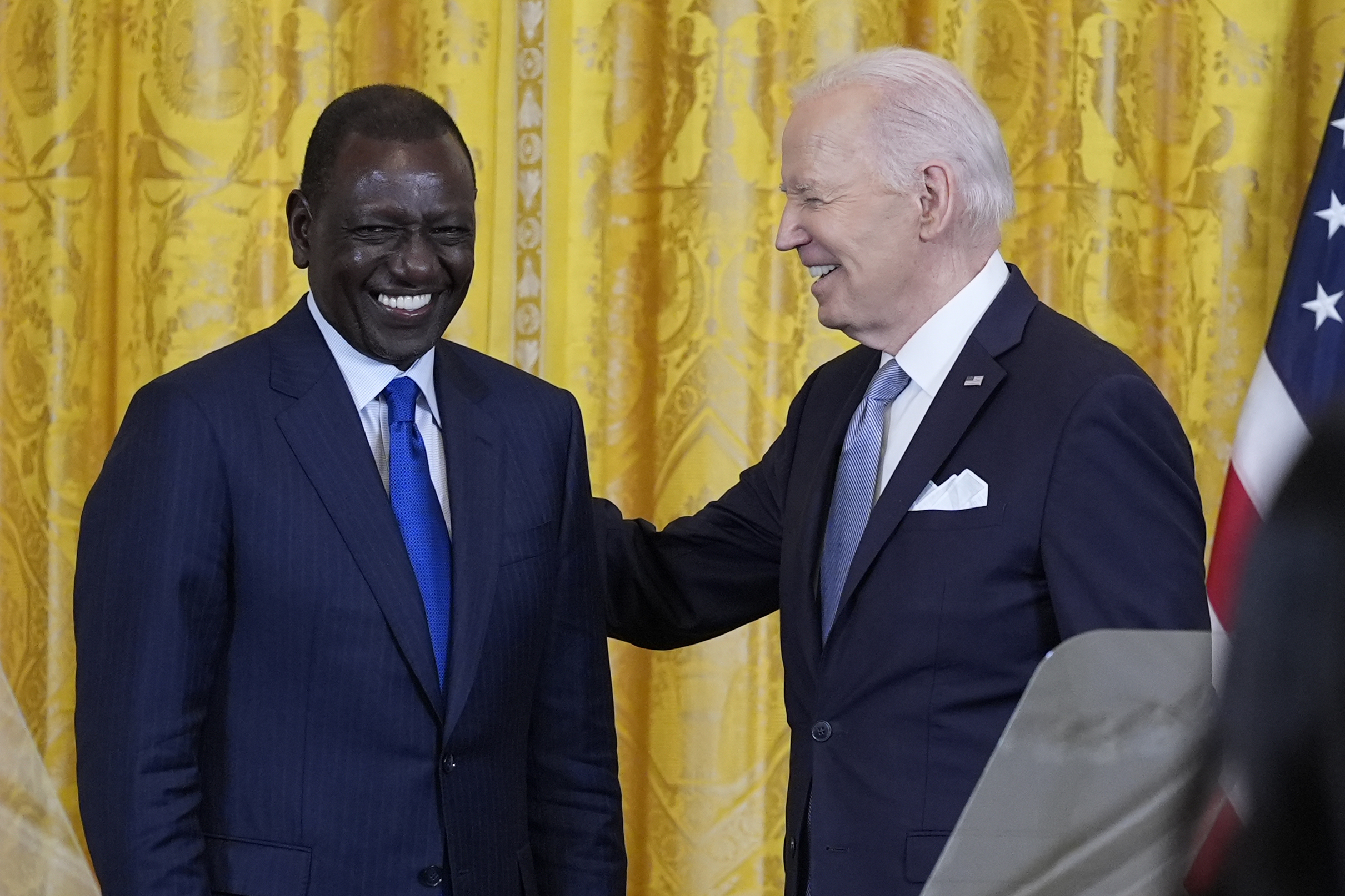 President Joe Biden and Kenya's President William Ruto talk following a news conference in the East Room of the White House in Washington