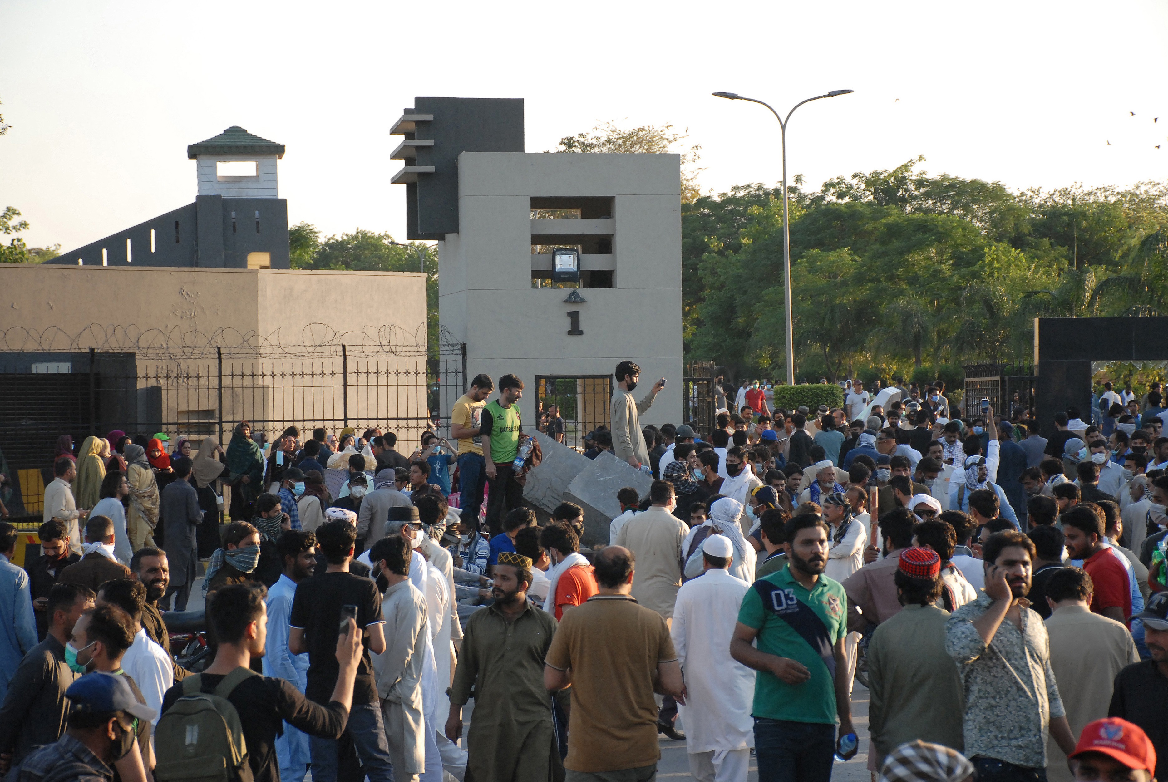 PTI supporters gathered outside Pakistani army's headquarters in Rawalpindi on May 9 last year. [Sohail Shahzad/EPA]