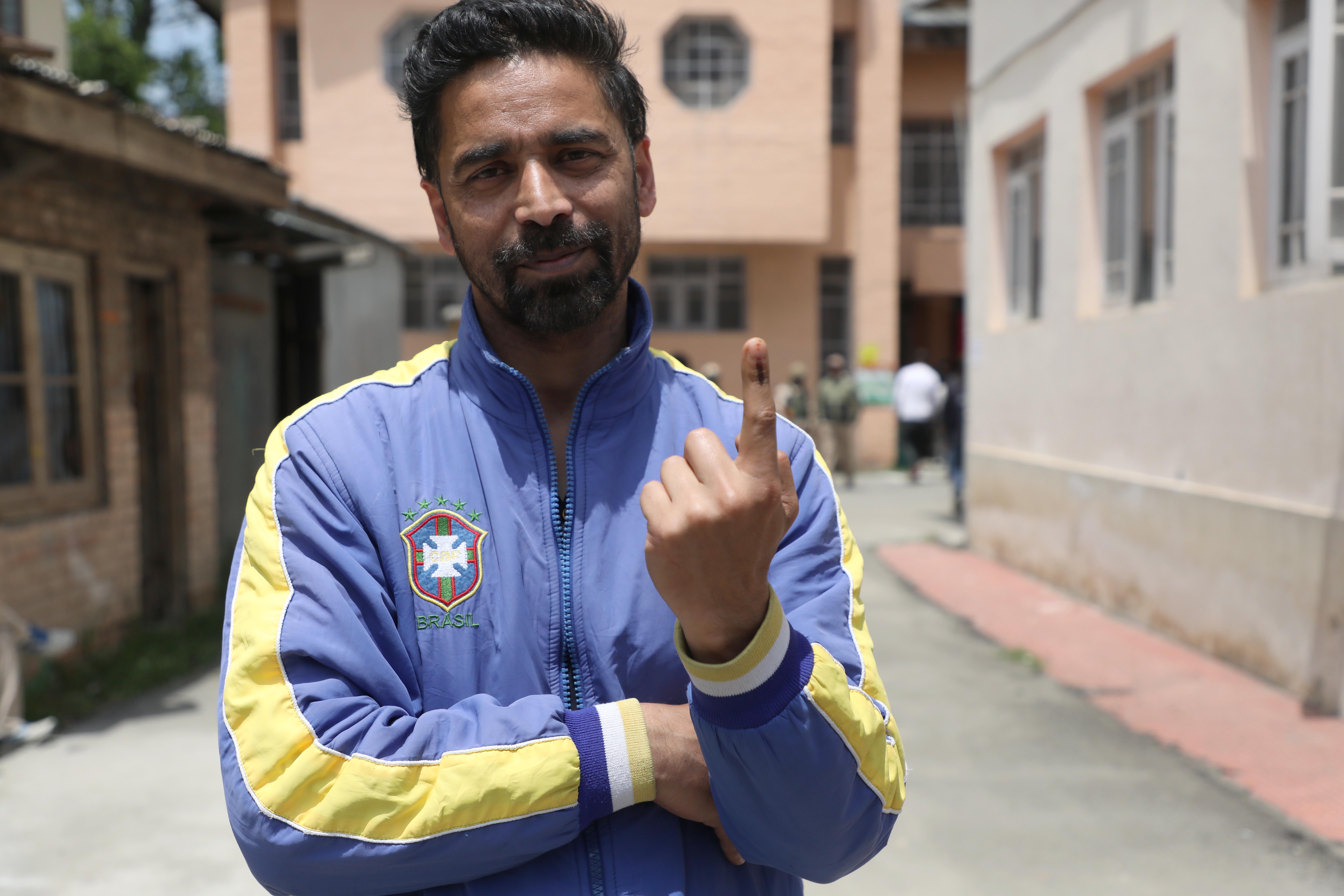 aheem Alam, a 38 year old web developer after casting his vote. Photo by Umer Asif
