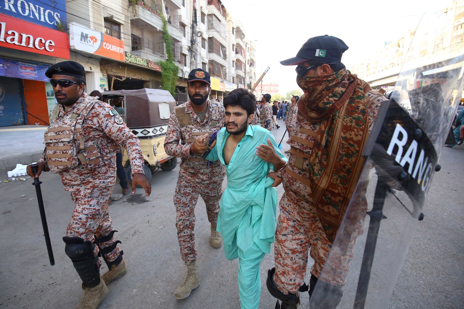 Authorities arrested thousands of PTI supporters in the next few days on charges of arson, rioting and vandalism. [Shahzaib Akber/EPA]