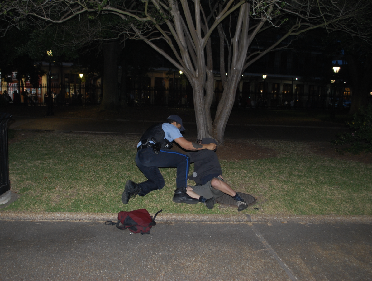 An officer tackles a pro-Palestine protester during an attempt at an off-campus encampment in New Orleans' city center