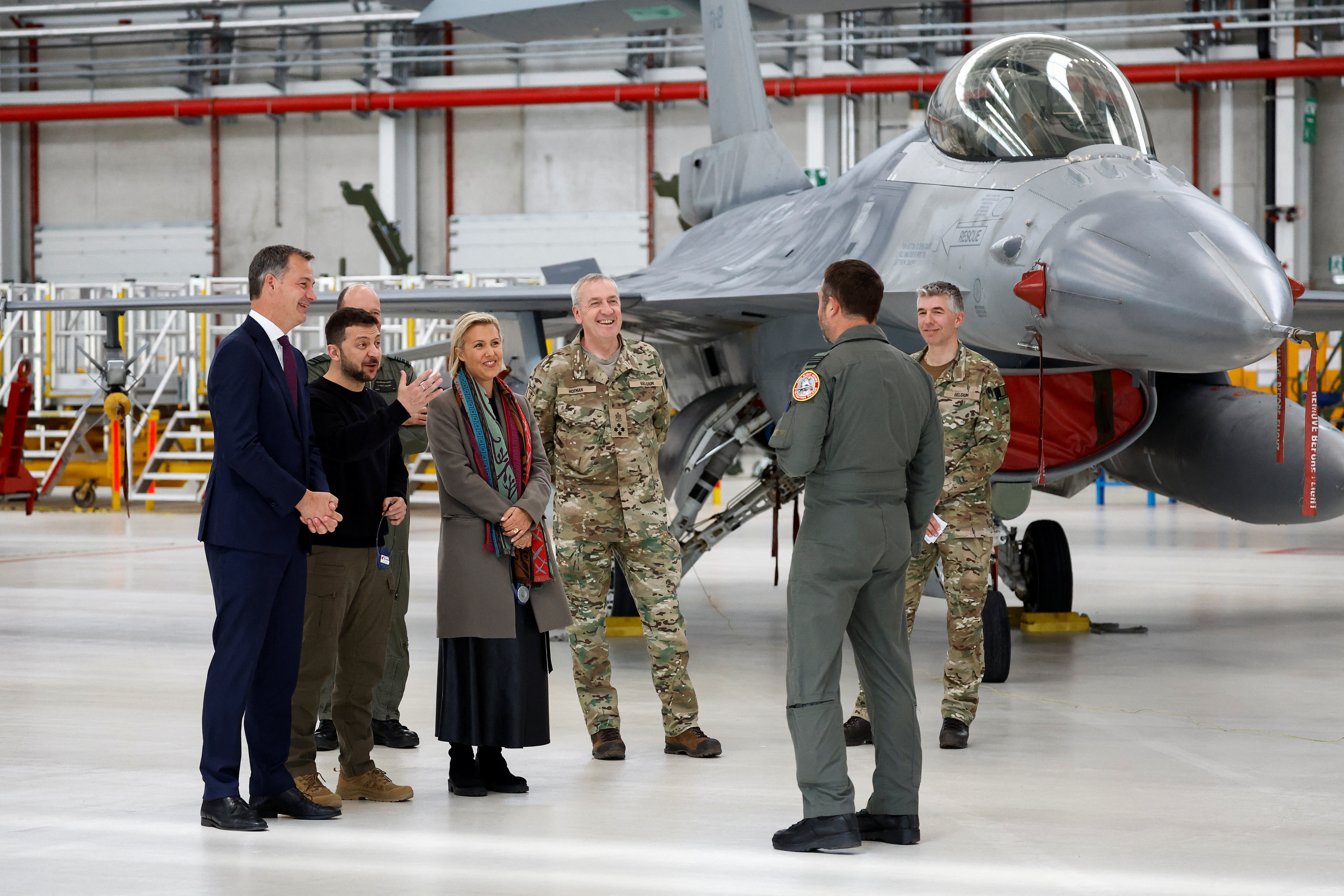 Ukraine's President Volodymyr Zelenskyy, Belgium's Prime Minister Alexander De Croo and Belgium's Defence Minister Ludivine Dedonder stand near an F-16 at Melsbroek airbase, near Brussels, Belgium, May 28, 2024