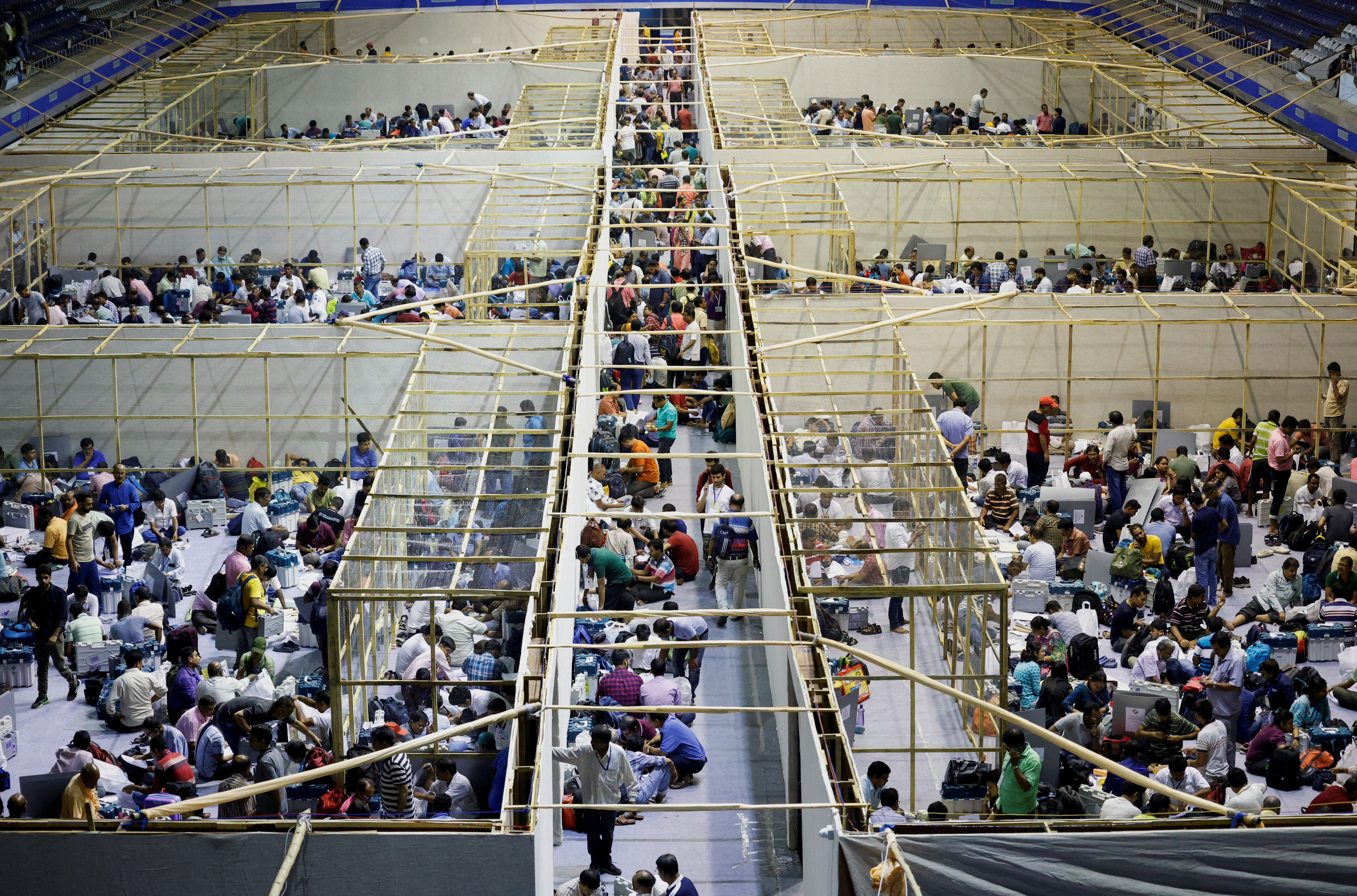 Polling officials check election materials inside an indoor stadium ahead of the seventh and last phase of India's general election, in Kolkata, India, May 31