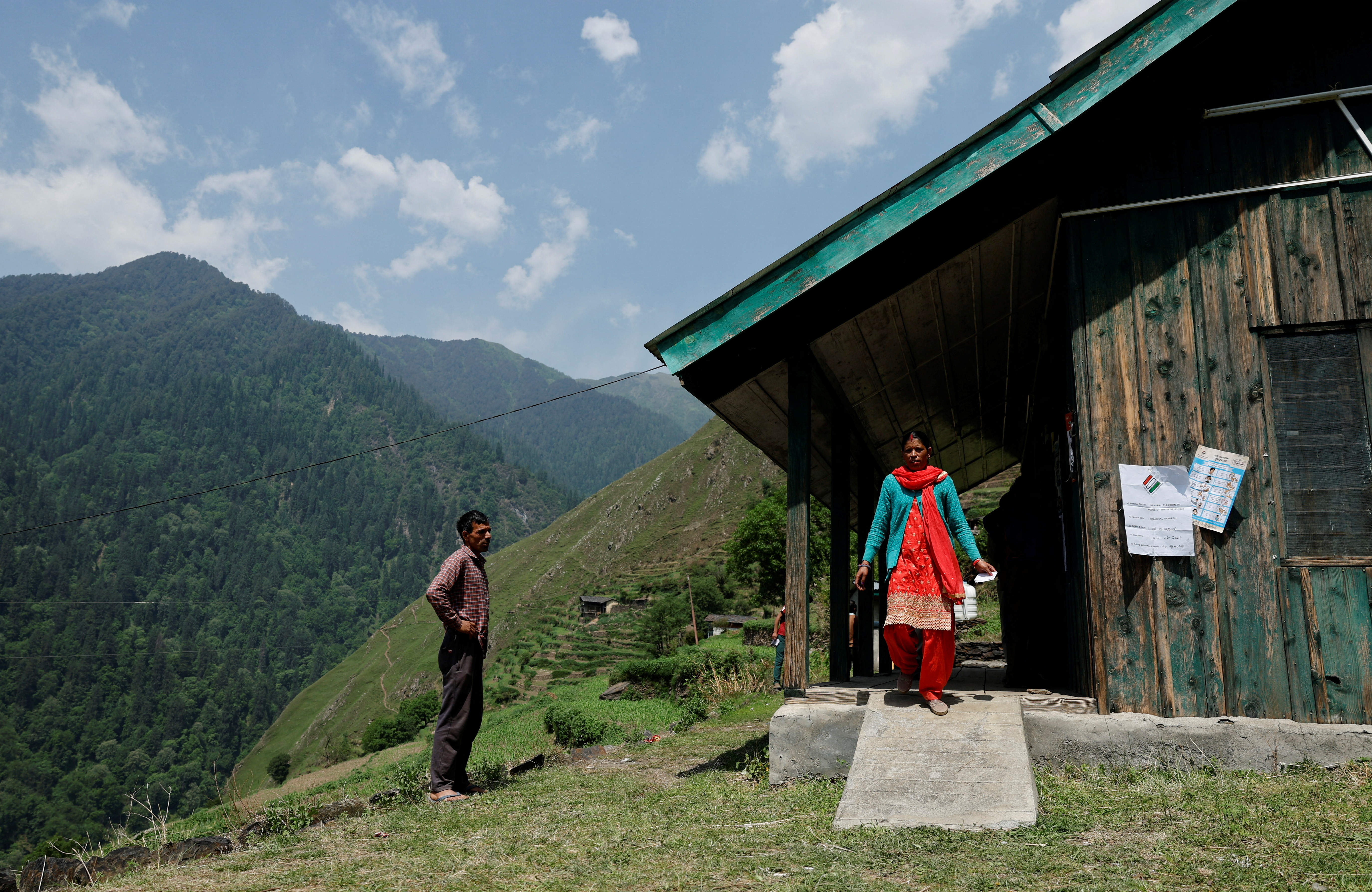 A woman leaves after voting at a remote polling station in Almi, on the seventh and final phase of the general elections, in Chamba, in the northern state of Himachal Pradesh, India, June 1, 2024