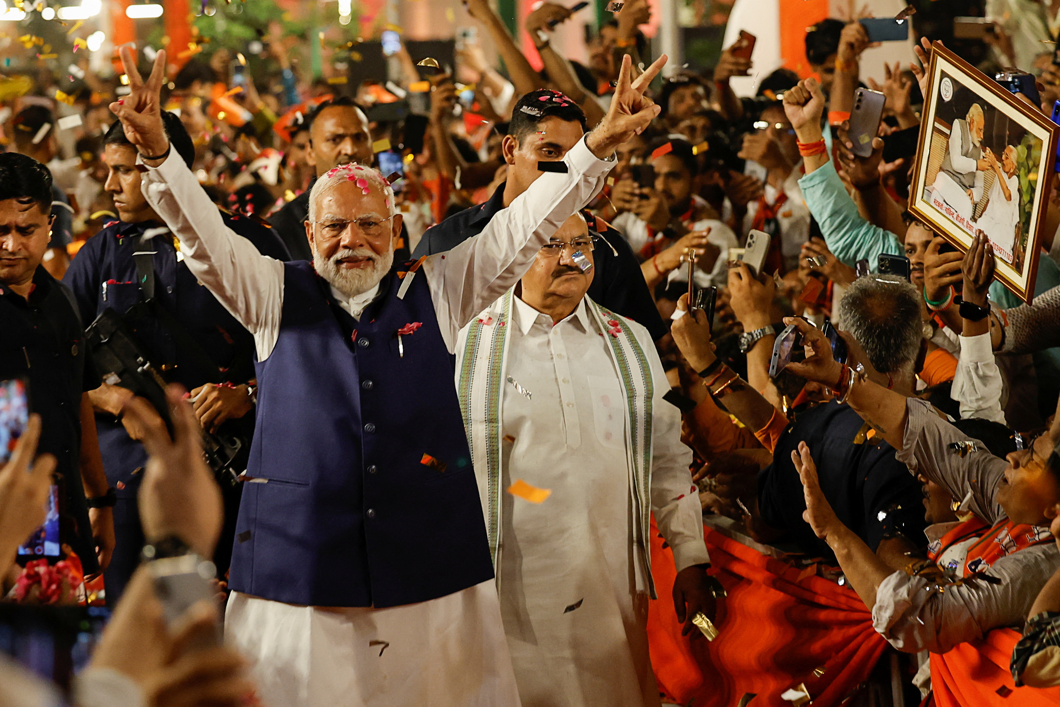 Indian Prime Minister Narendra Modi gestures as he arrives at Bharatiya Janata Party (BJP) headquarters in New Delhi