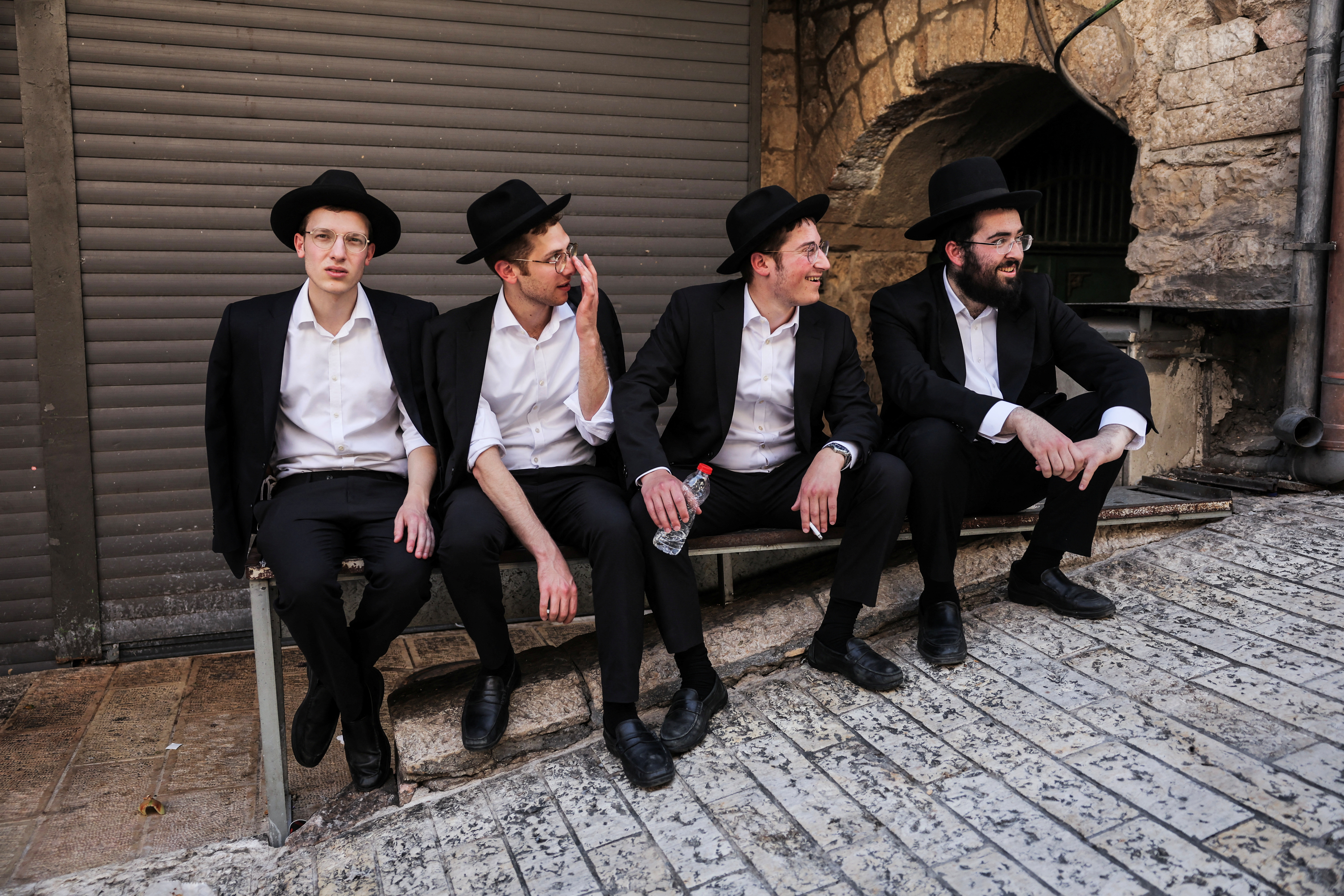 Israelis march through the alleyways of Jerusalem's Old City to the Western Wall, waving Israeli flags on 'Jerusalem Day' to commemorate the establishment of Israeli control over the city.