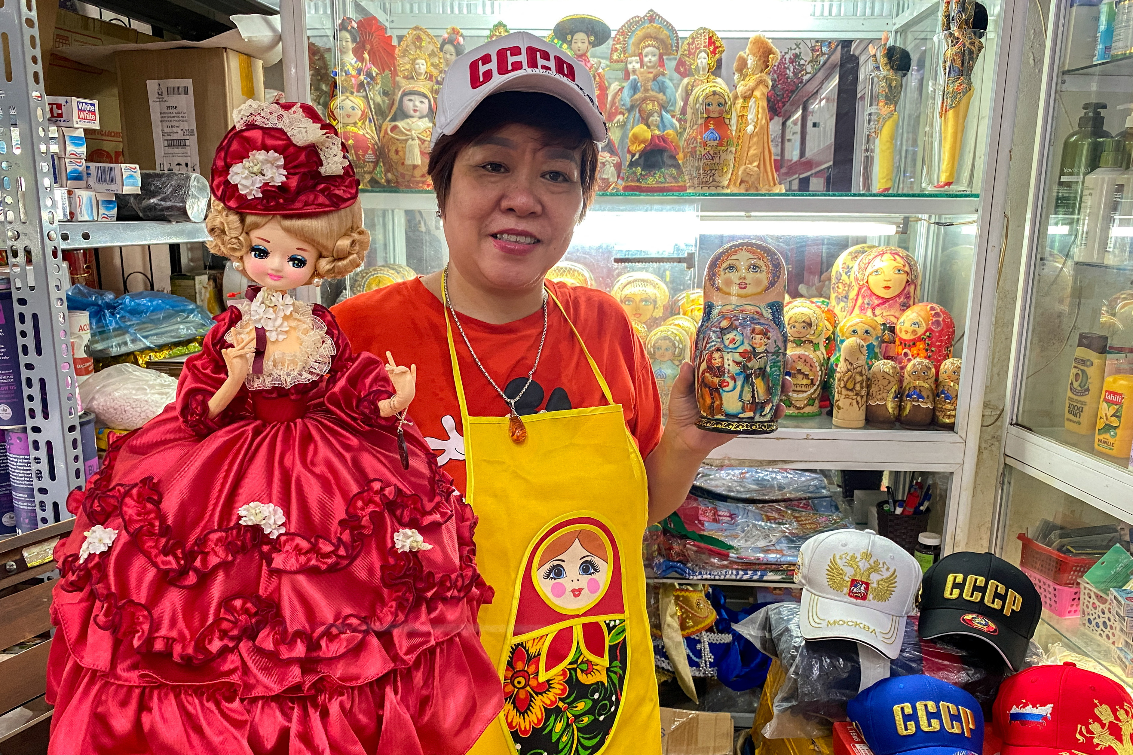Nguyen Thi Hong Van, 55, a collector and seller of Russian souvenirs who lived and worked in Russia for 20 years, poses at her shop in Hanoi, Vietnam