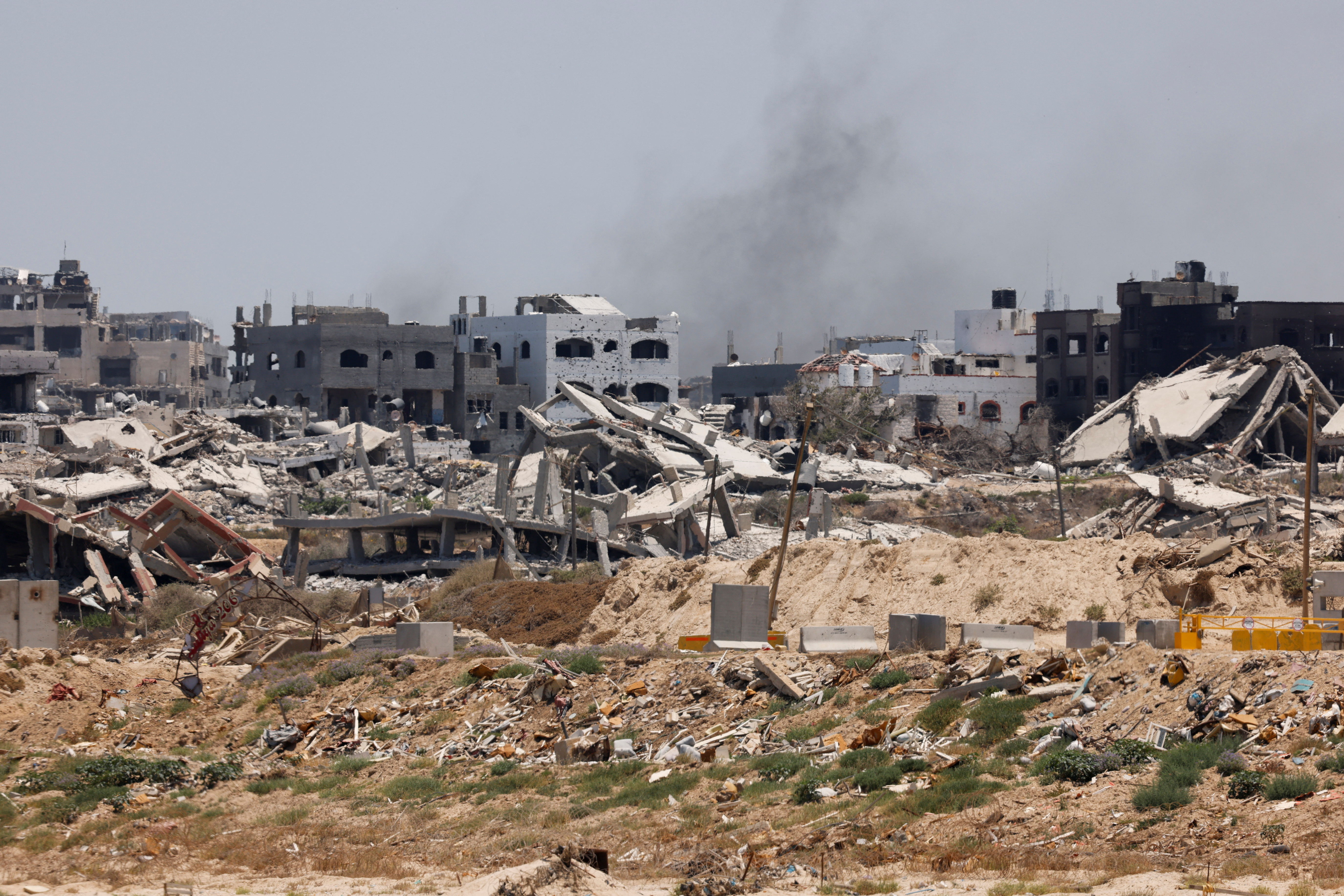 Destroyed buildings stand in Gaza, amid the ongoing conflict between Israel and Hamas, as seen near the Gaza coast, June 25, 2024. REUTERS/Amir Cohen