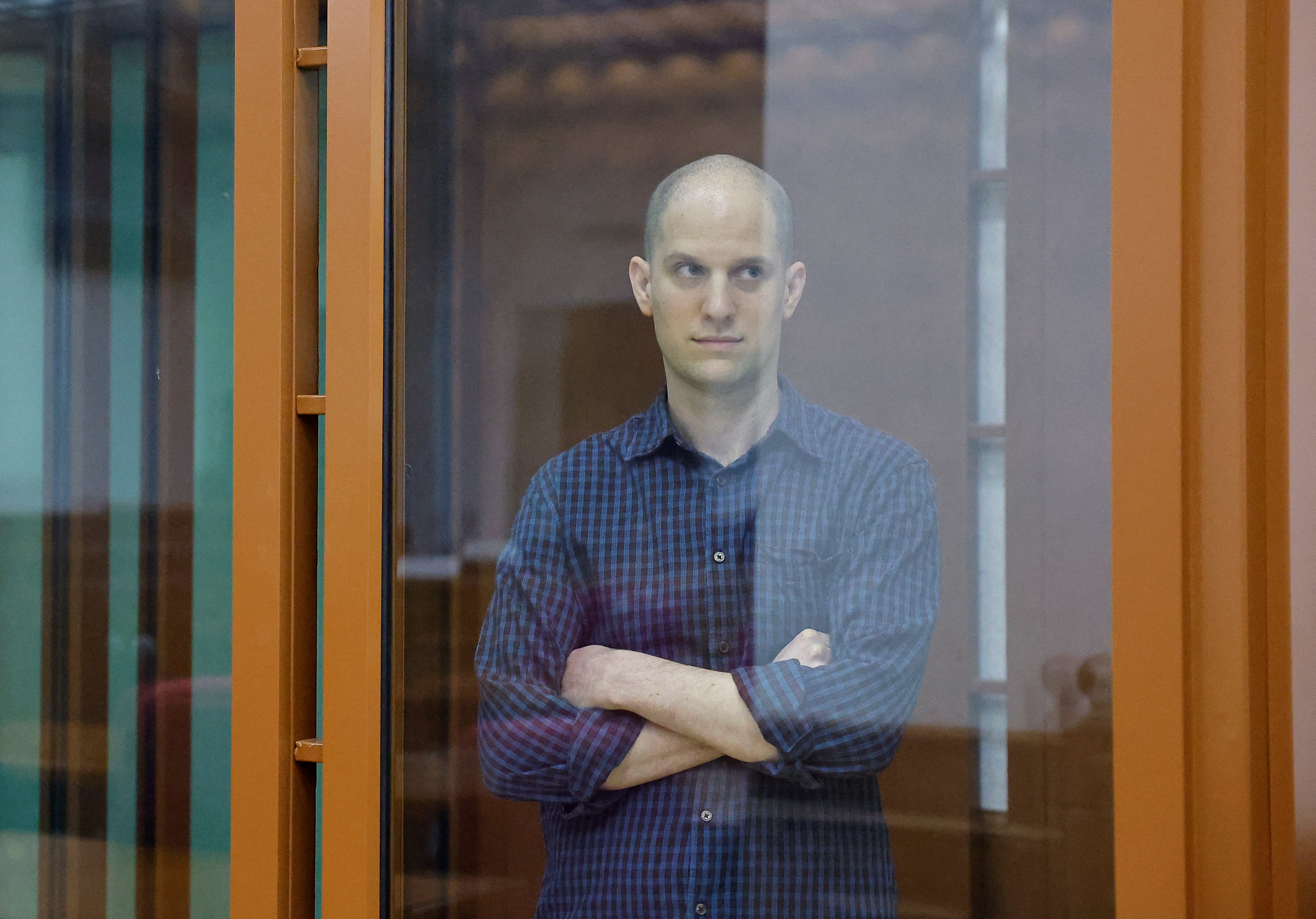 Wall Street Journal reporter Evan Gershkovich, who stands trial on spying charges, is seen inside an enclosure for defendants before a court hearing in Yekaterinburg, Russia