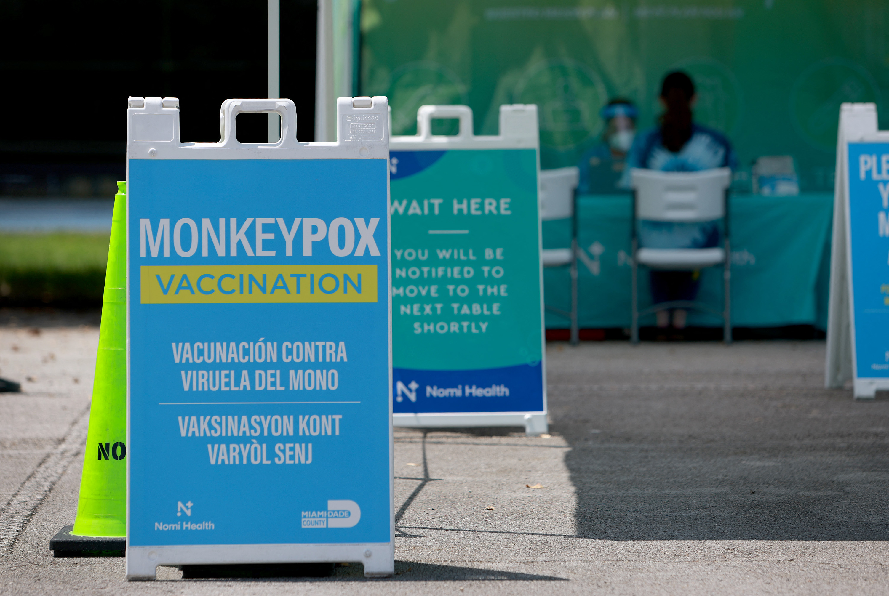 MIAMI, FLORIDA - AUGUST 15: A sign announcing monkeypox vaccination is setup in Tropical Park by Miami-Dade County and Nomi Health on August 15, 2022 in Miami, Florida. Miami-Dade continues to urge people to vaccinate as they work to get more vaccines now that the county has over 400 cases, which is the most in the state. Joe Raedle/Getty Images/AFP (Photo by JOE RAEDLE / GETTY IMAGES NORTH AMERICA / Getty Images via AFP)