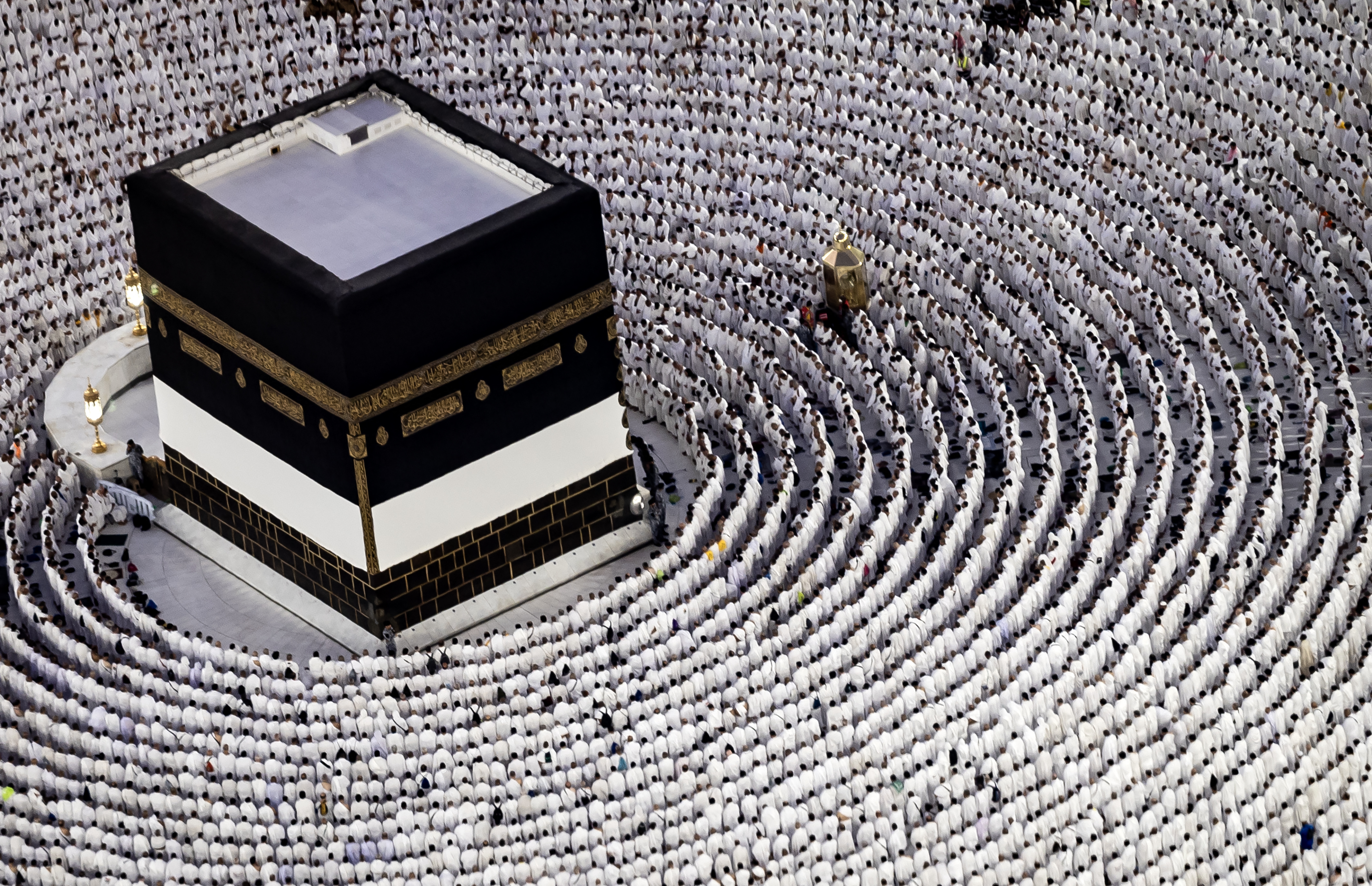 Muslim worshippers pray around the Kaaba, Islam's holiest shrine, at the Grand Mosque in Saudi Arabia's holy city of Mecca on June 13