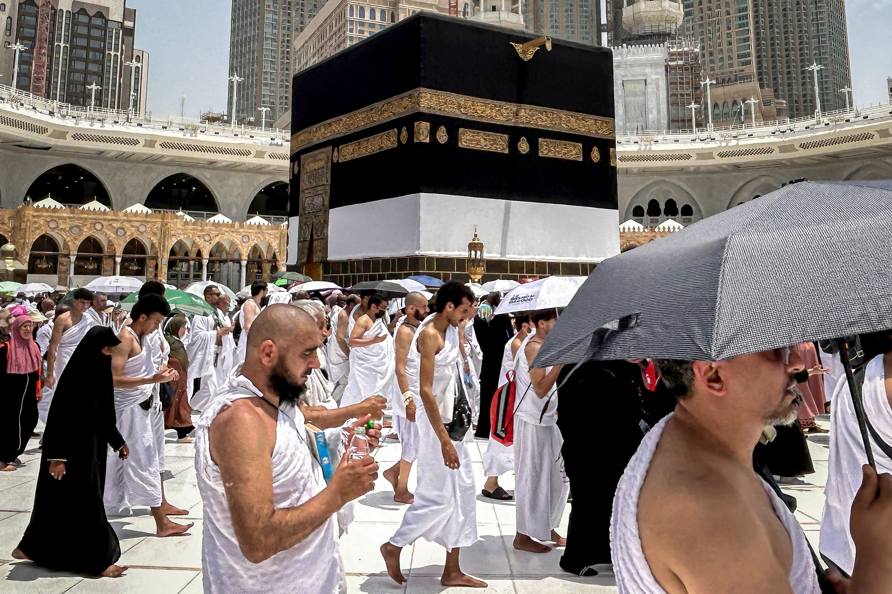Muslim worshippers walk around the Kaaba, Islam's holiest shrine, at the Grand Mosque in Saudi Arabia's holy city of Mecca