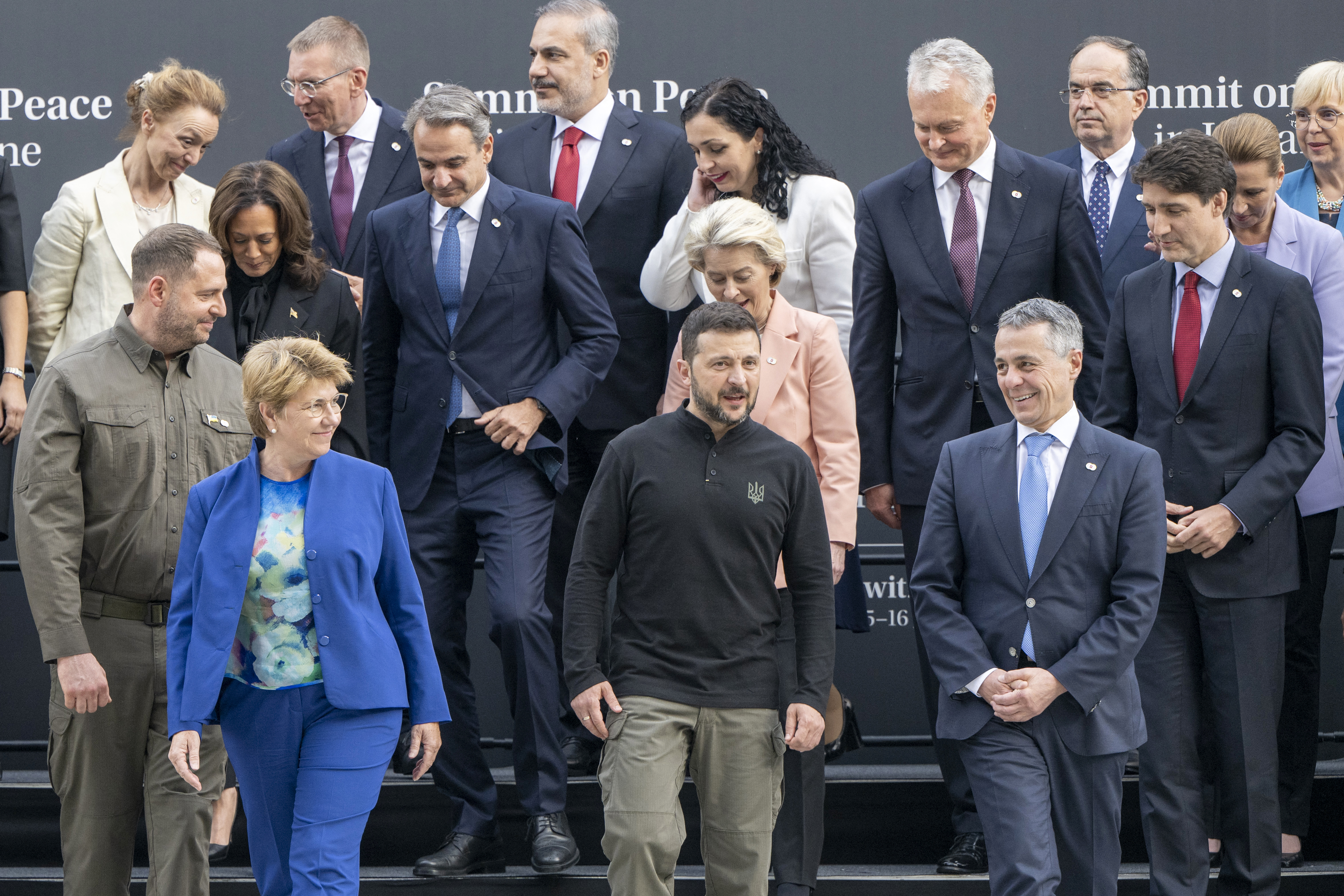 Ukraine's President Volodymyr Zelensky (C), Swiss Federal President Viola Amherd (C-L), Swiss Foreign Minister Ignazio Cassis (C-R) and other heads of states and country representatives leave after posing for a family photograph during the Summit on peace in Ukraine, at the luxury Burgenstock resort, near Lucerne, on June 15, 2024. World leaders from countries around the world gather in Switzerland this weekend to try to work out a way towards a peace process for Ukraine -- albeit without Russia. (Photo by URS FLUEELER / POOL / AFP)