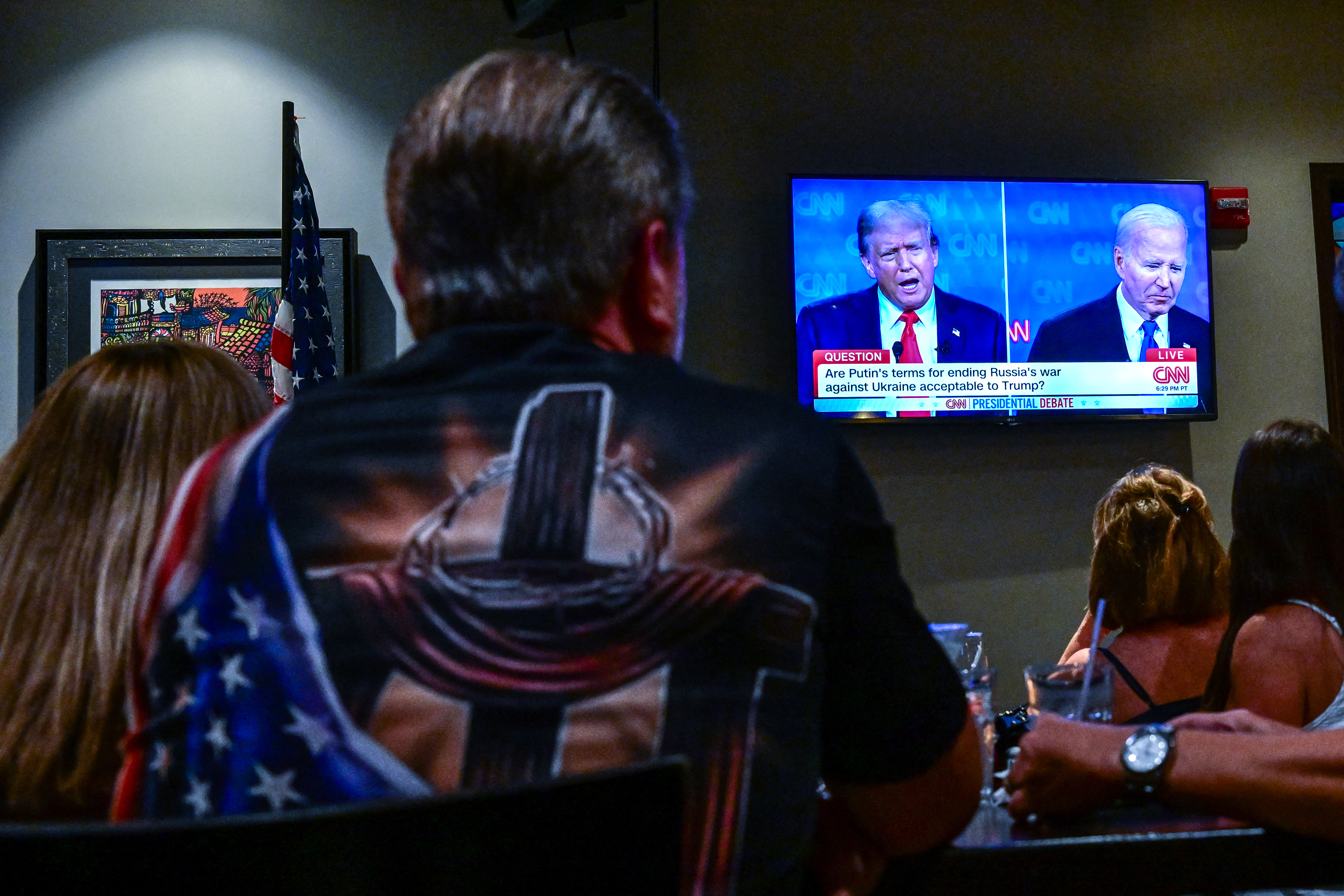 Supporters of Donald Trump attend a watch party for the first presidential debate of the 2024 presidential elections between US President Joe Biden and former US President and Republican presidential candidate Donald Trump in Miami, on June 27