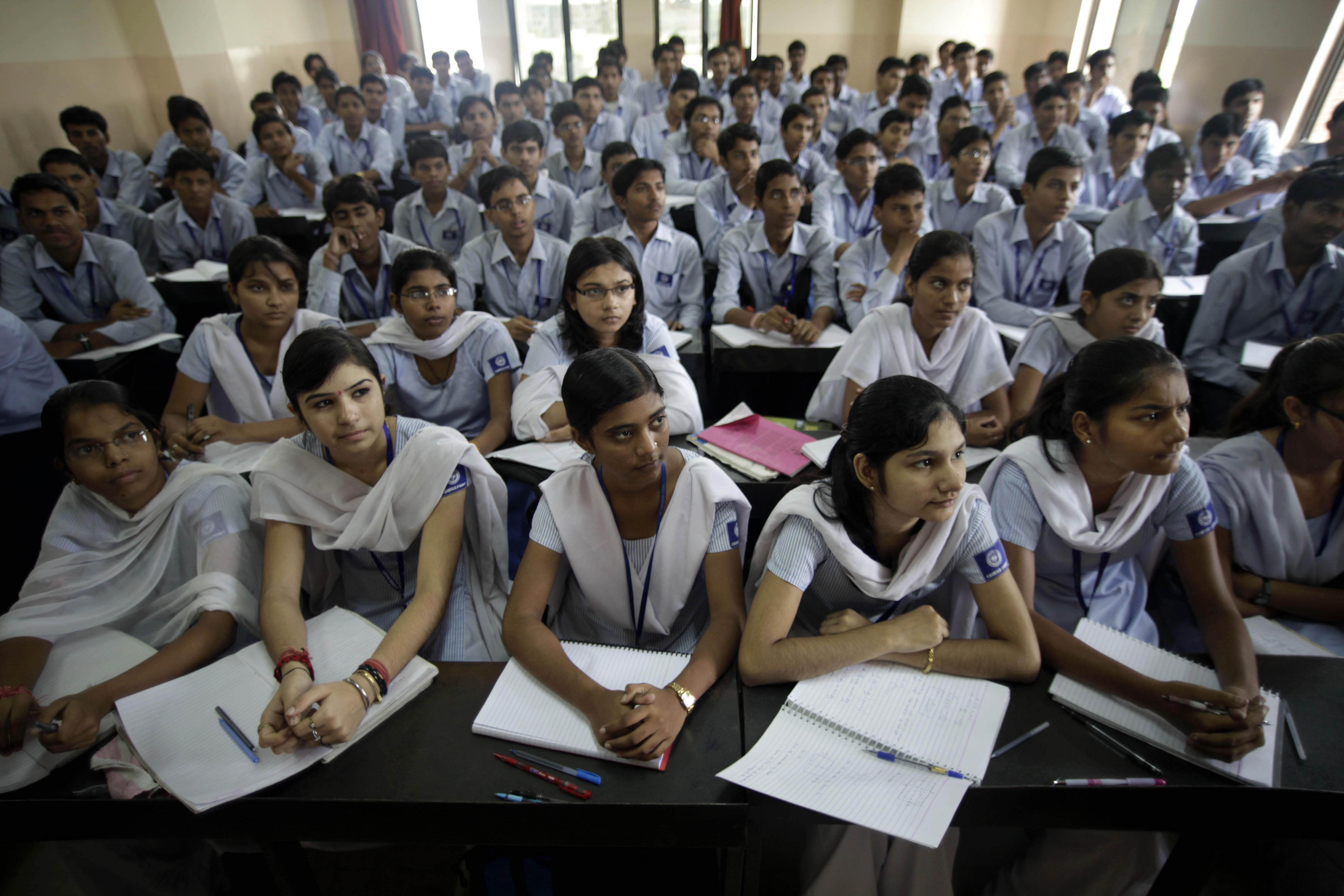 In this Thursday, Aug. 5, 2010 photograph, students attend a class at a cram school in Kota, India. Every year, more than 450,000 students take the Indian Institutes of Technology (IIT) exam, hoping for entry to the hallowed public engineering institutes located across India. Slightly more than 13,000 passed in 2010, a 3 percent success rate. (AP Photo/Saurabh Das)